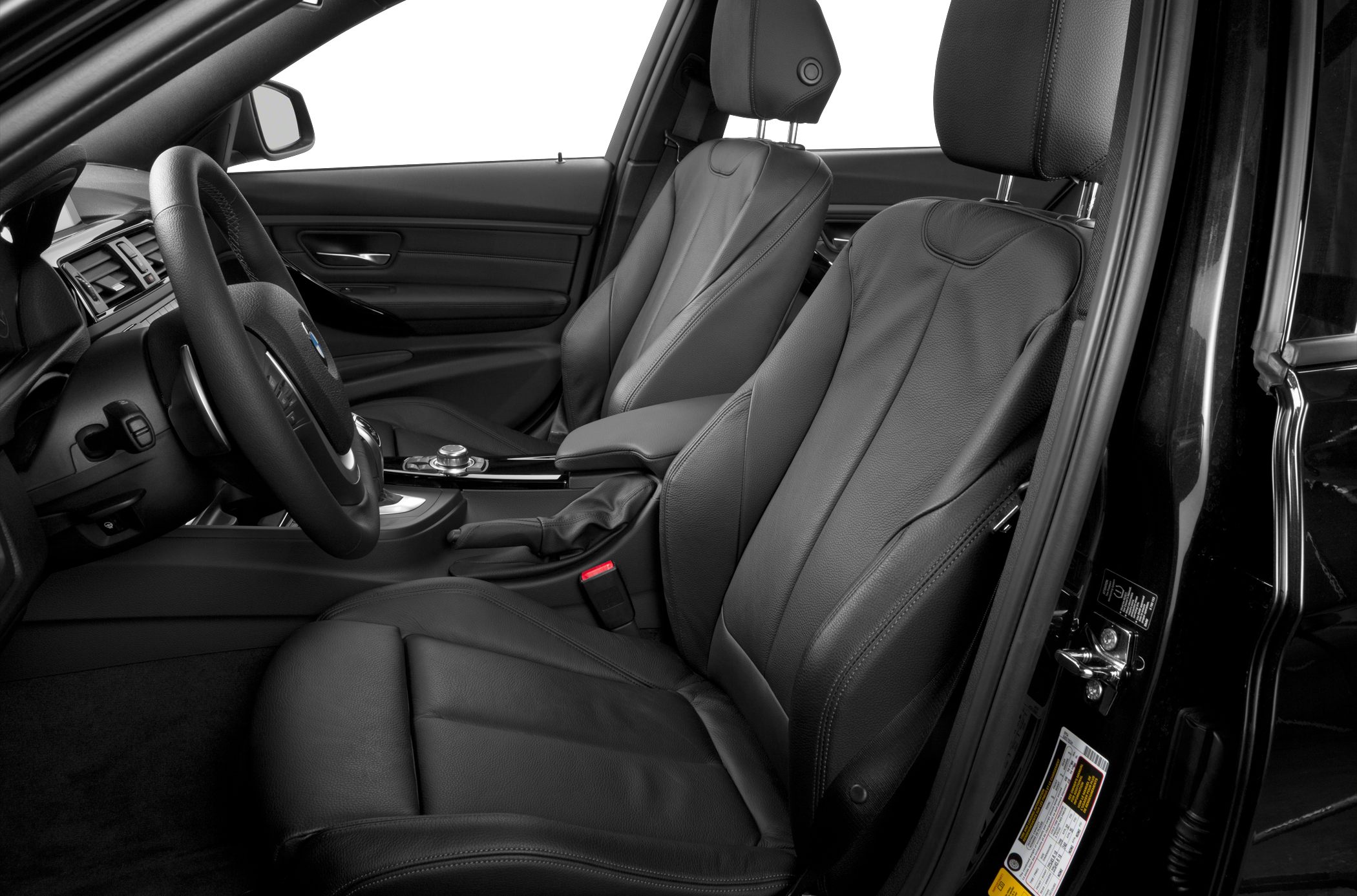 Black leather front seats with steering wheel and center console