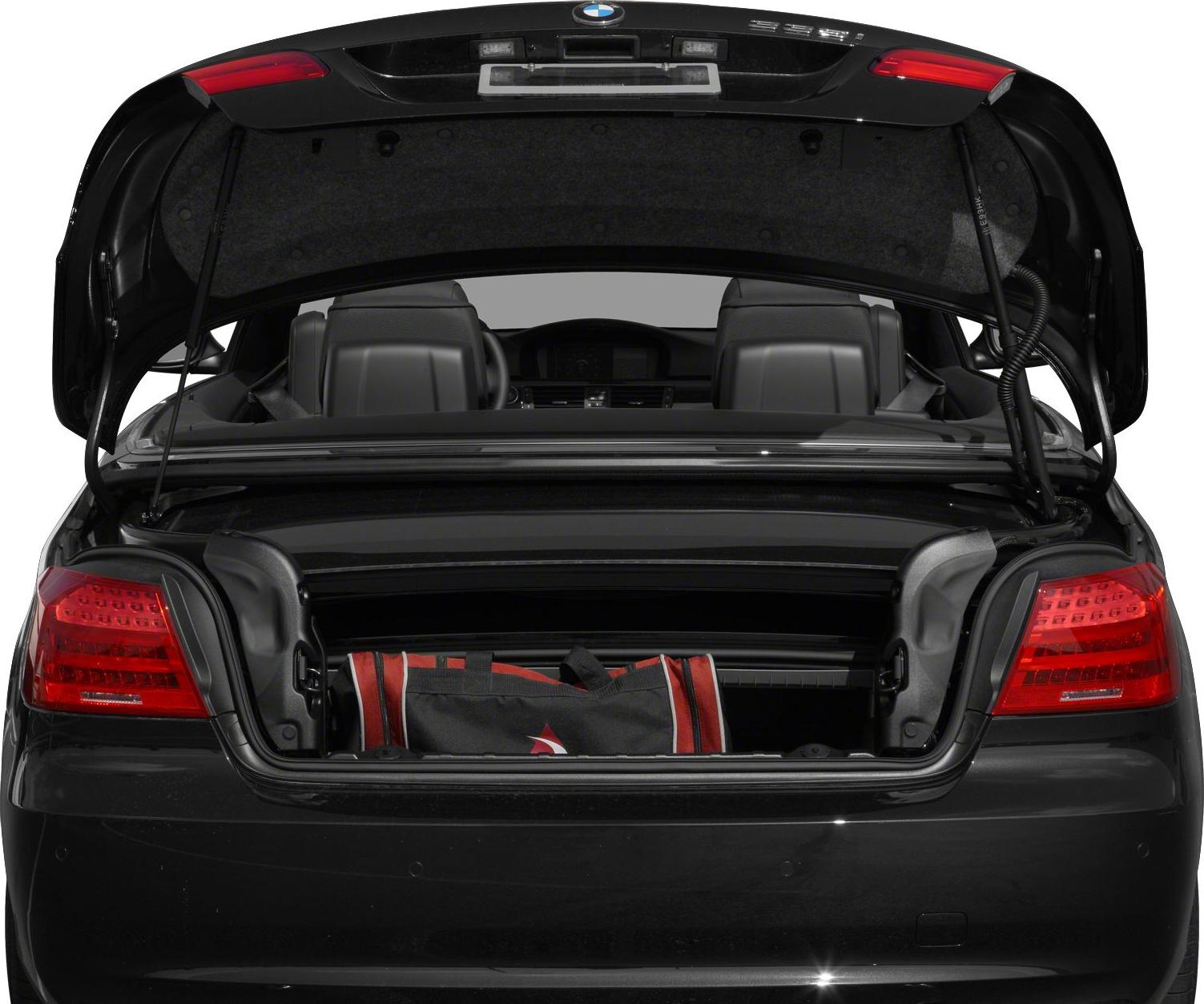Rear view with open trunk and visible folded roof compartment