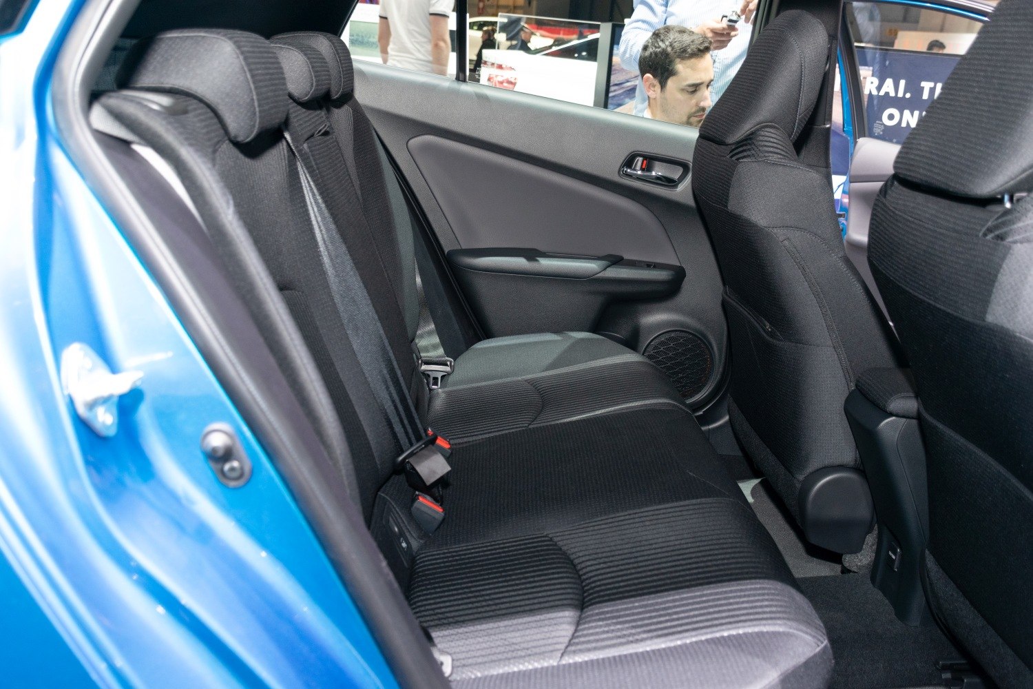 Rear interior seating with door panel of compact vehicle