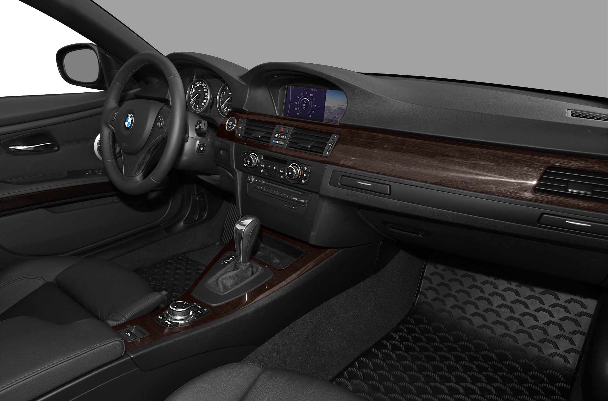Dashboard and center console with wood trim and navigation display