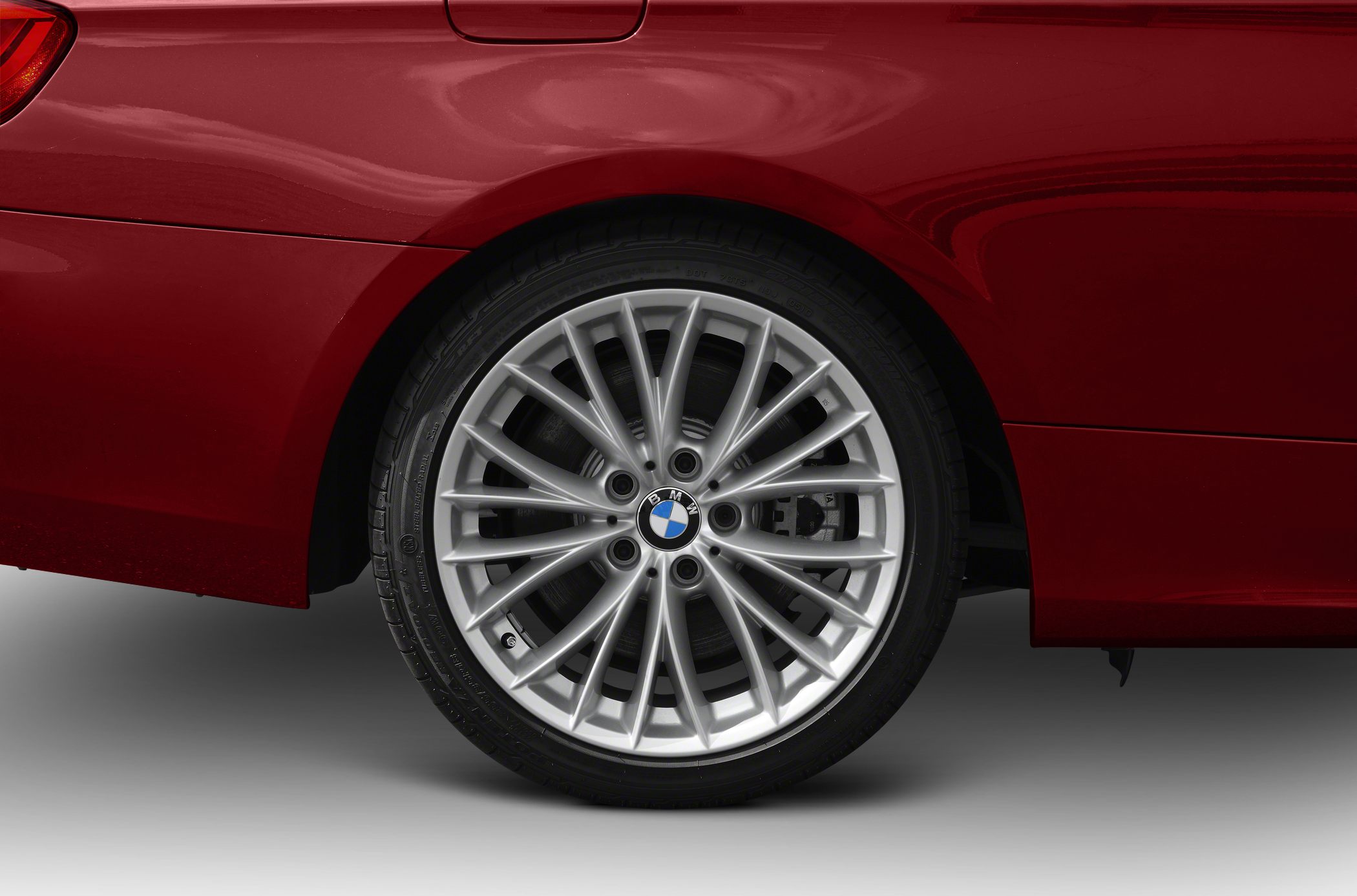 Silver multi-spoke alloy wheel with visible BMW center cap