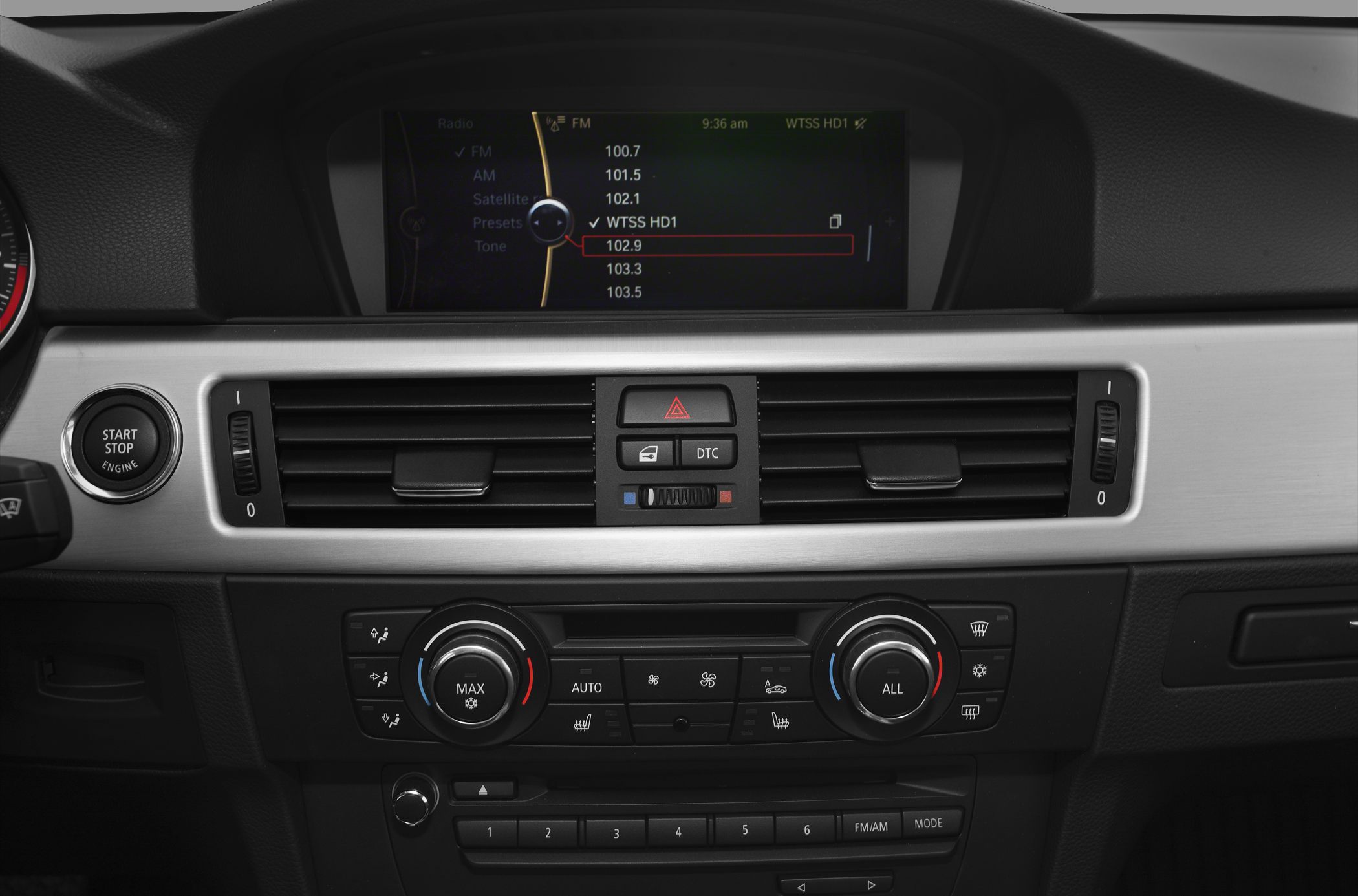 Dashboard with infotainment screen, climate control, start-stop button
