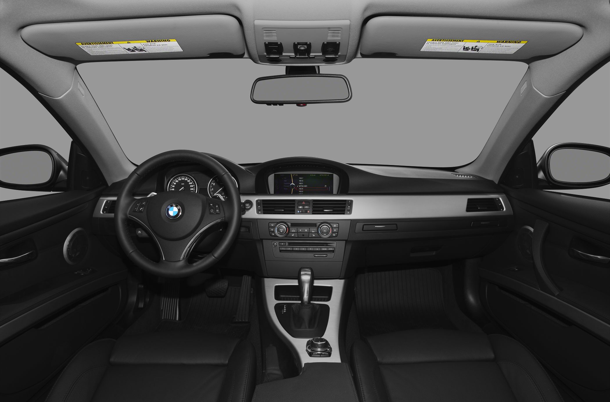 BMW coupe interior with dashboard, steering wheel, and center console