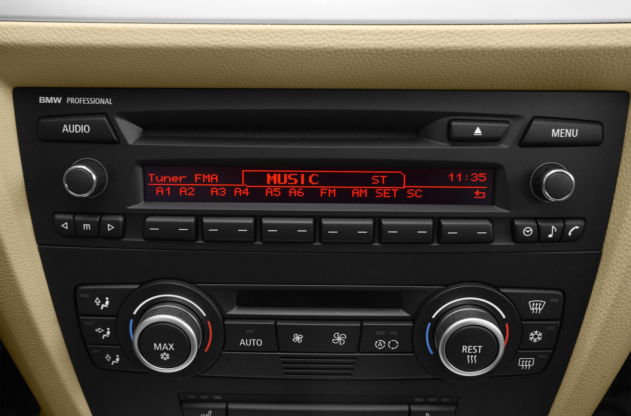 BMW E90 LCI radio and climate control panel with digital display and manual dials
