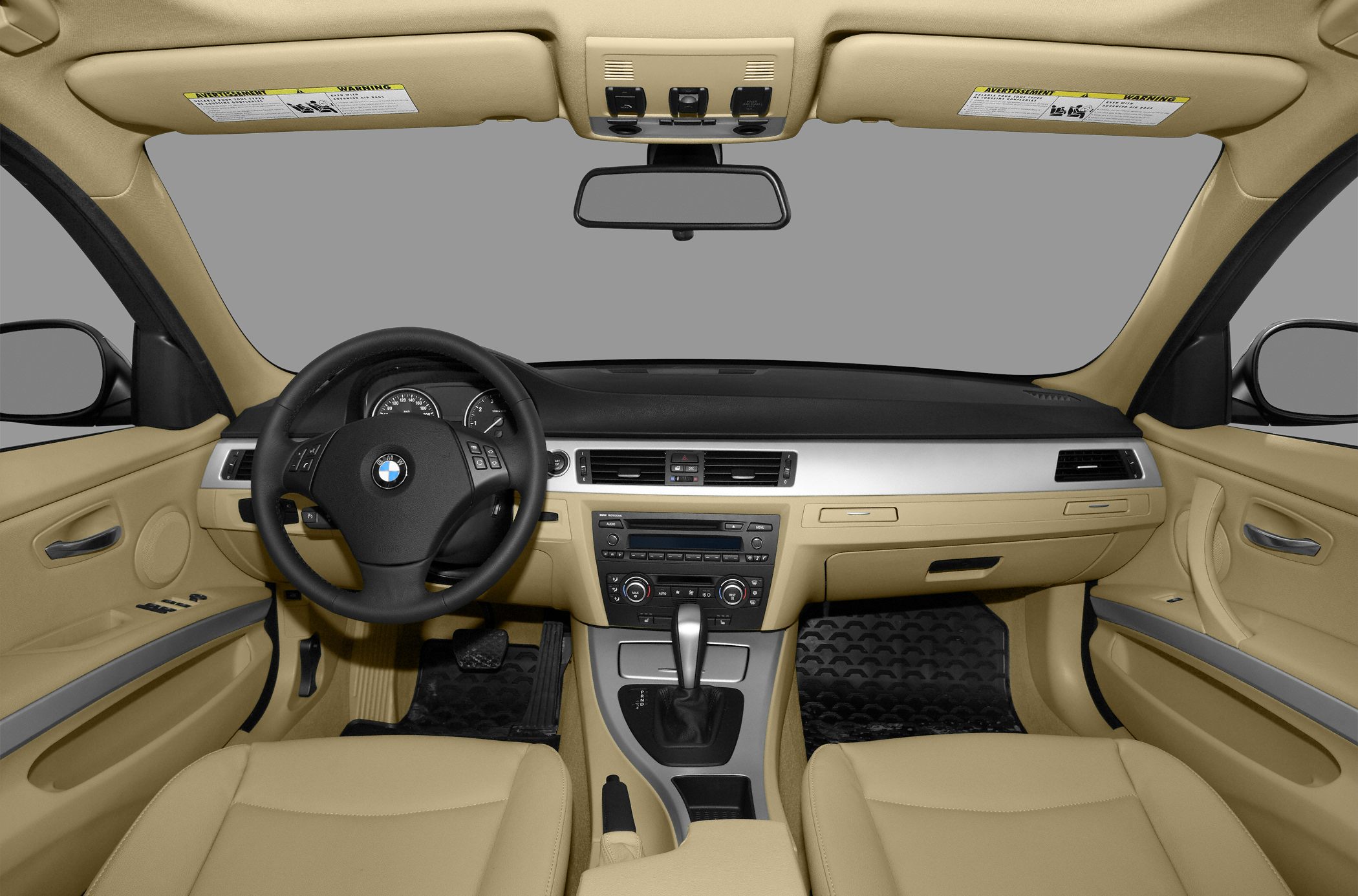 Beige interior dashboard and steering wheel with center console and controls