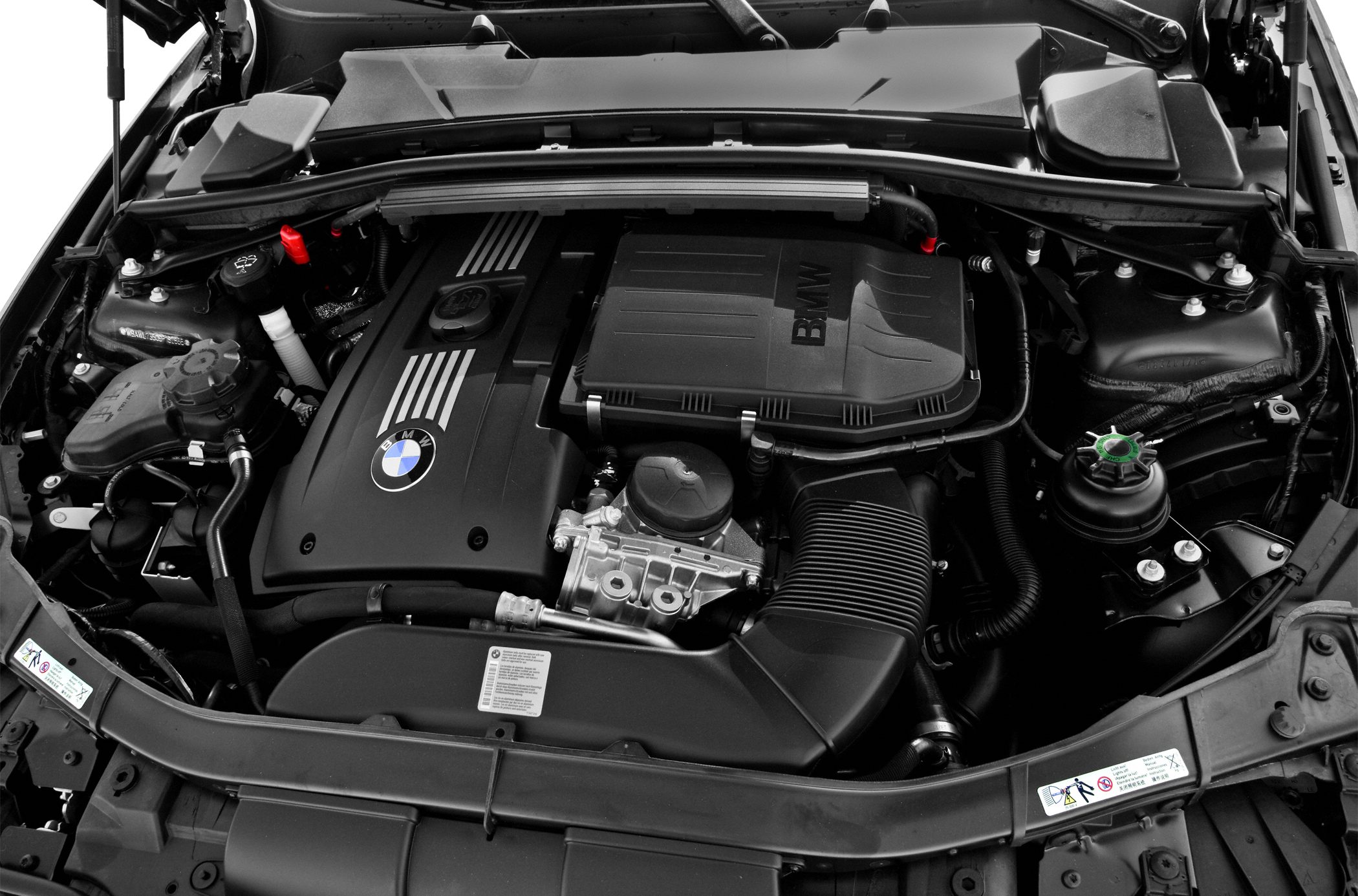 Engine compartment with BMW branded engine cover and components