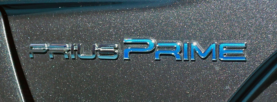 Close-up of Prius Prime hybrid badge with detailed lettering