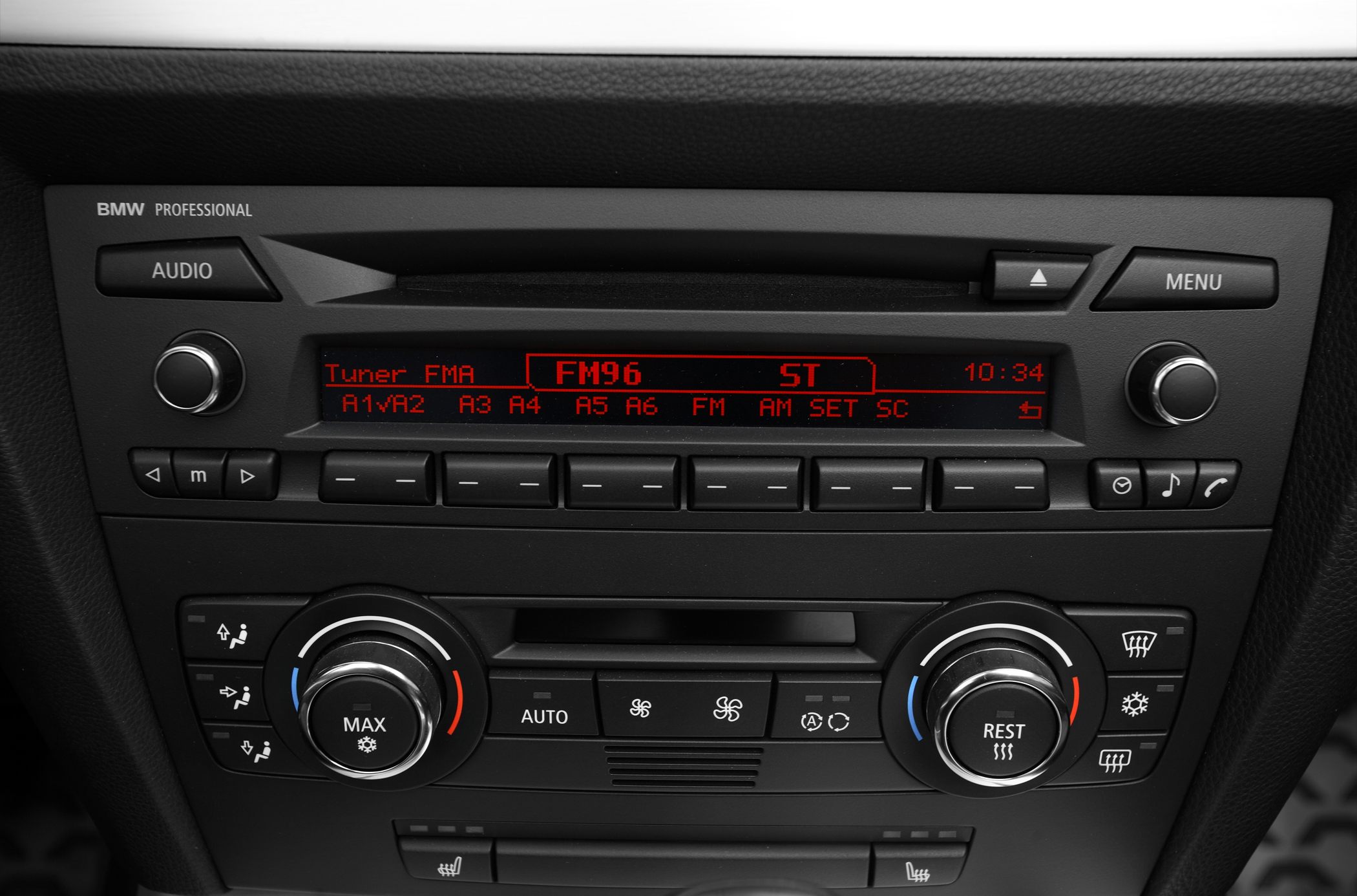 Car audio and climate control panel with red display and rotary knobs