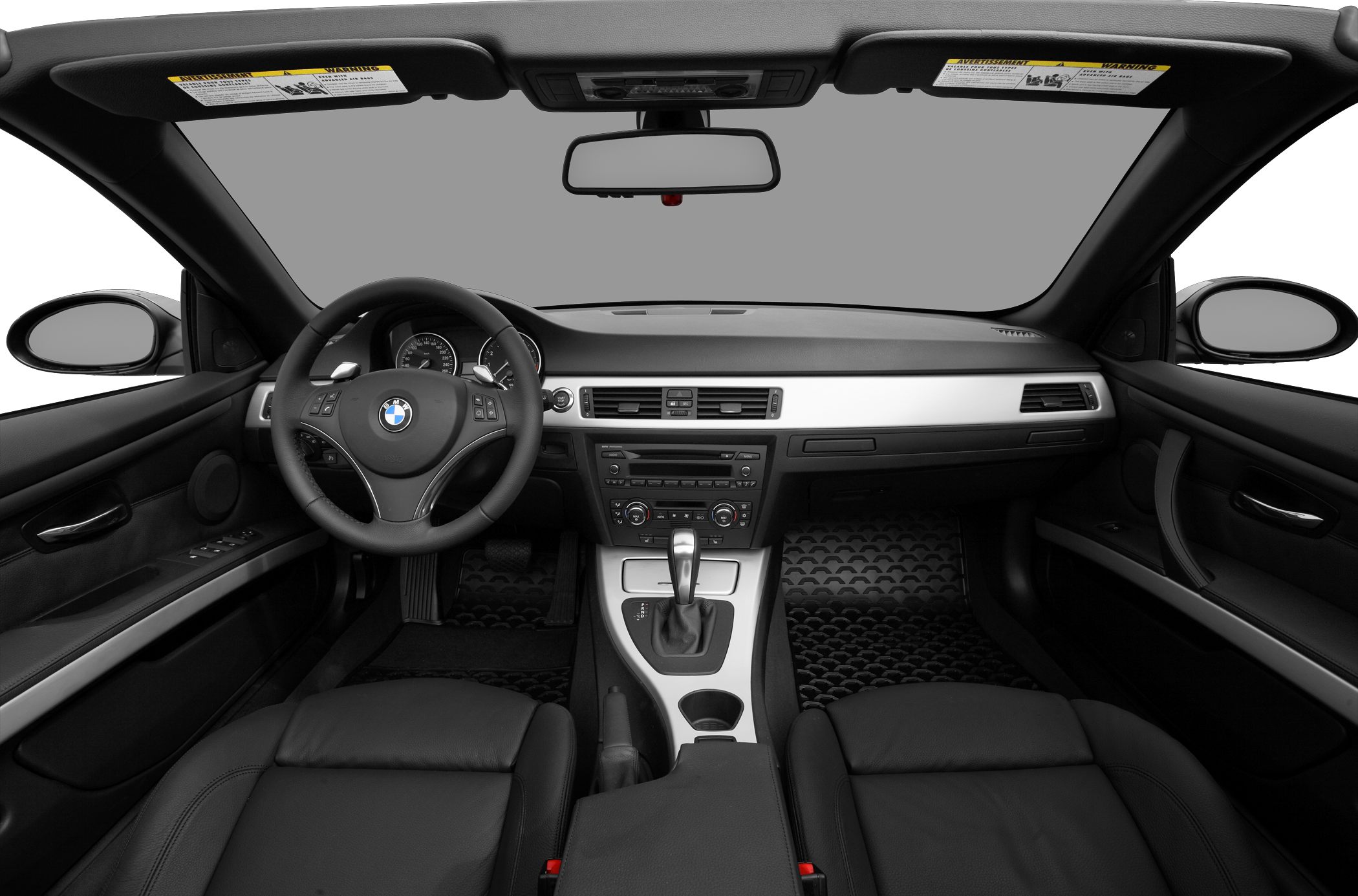 Convertible car interior with dashboard, steering wheel, and center console