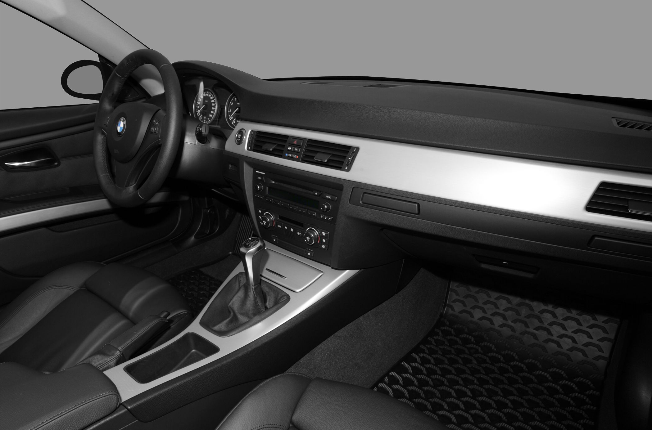 BMW coupe interior with manual gearshift and dashboard