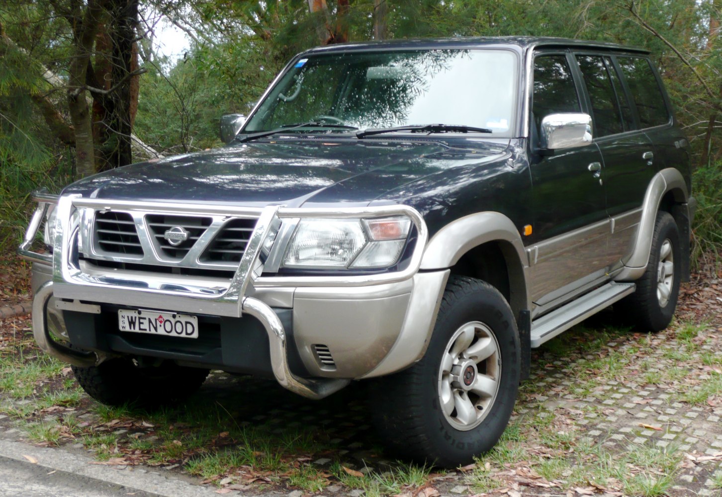 Front view of SUV with bull bar and off-road tires