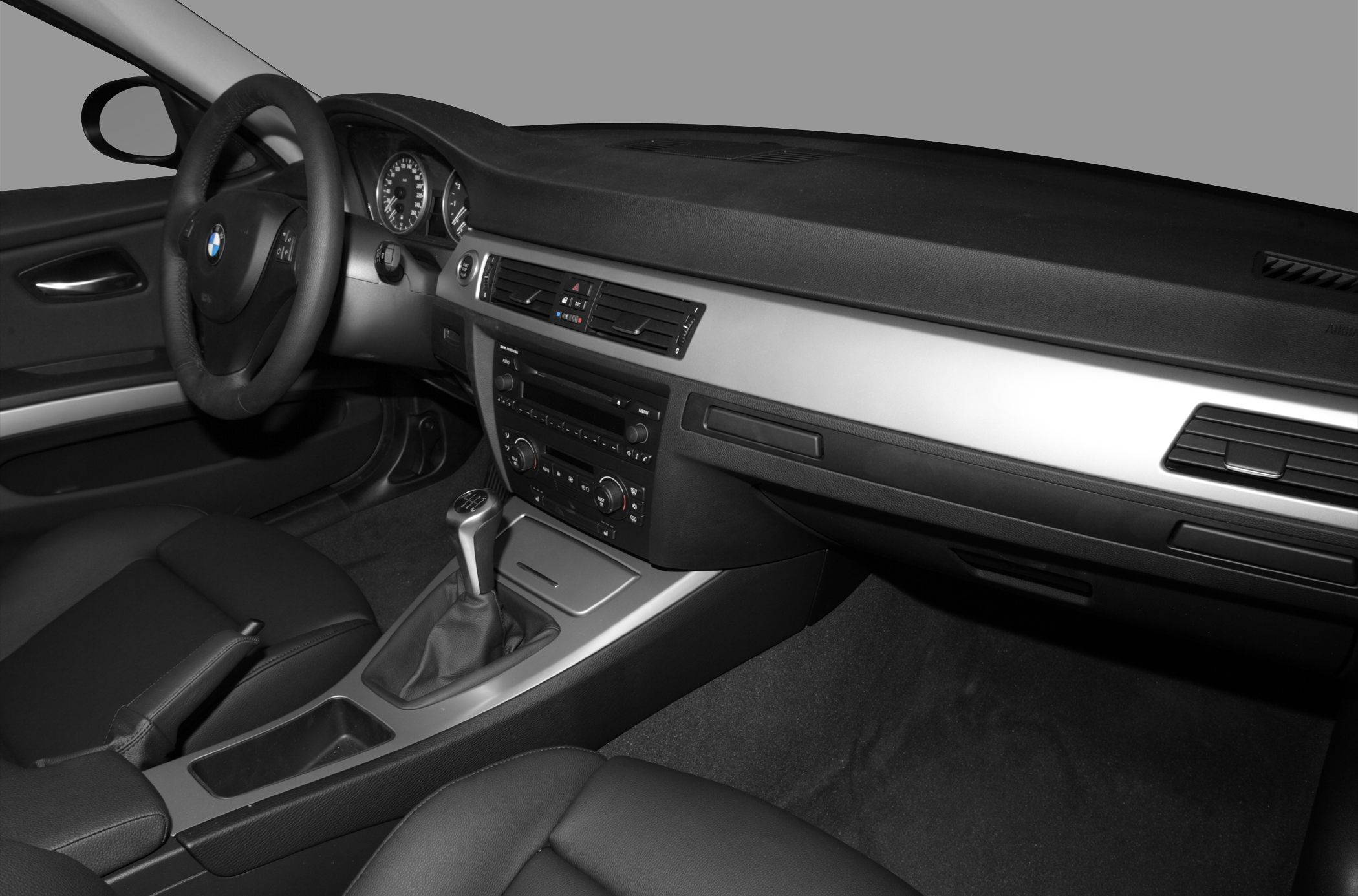 Manual gear shift, dashboard, steering wheel, car interior