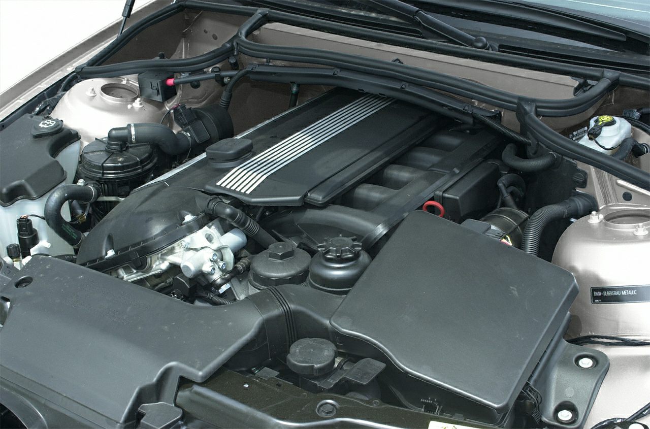 Engine compartment with inline-six engine and components