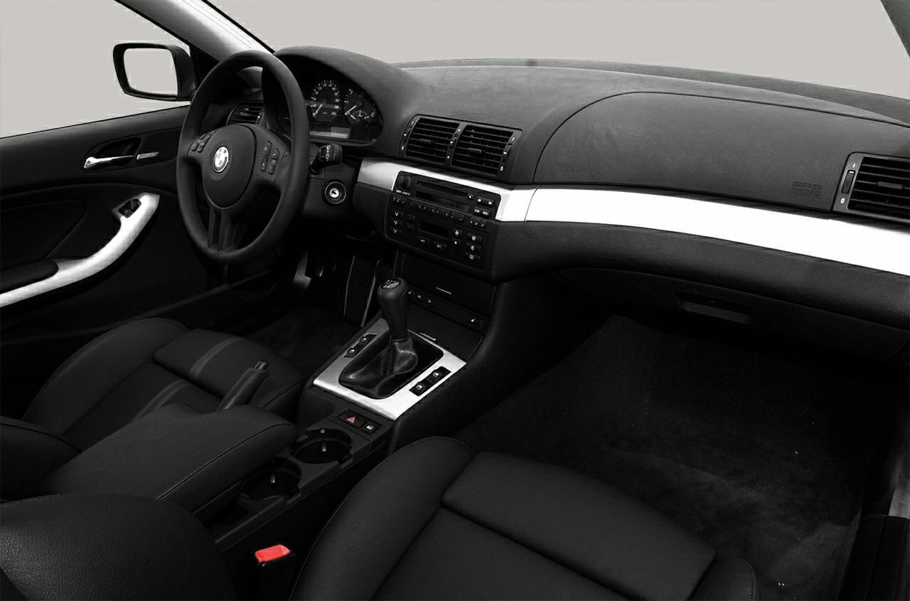 Interior dashboard and steering wheel with black upholstery