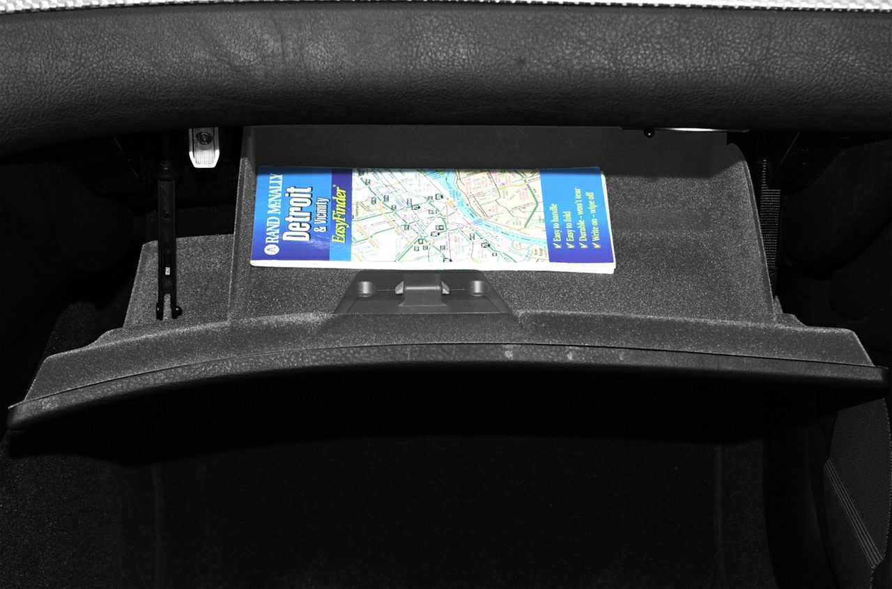 Glove box interior compartment with inserted map