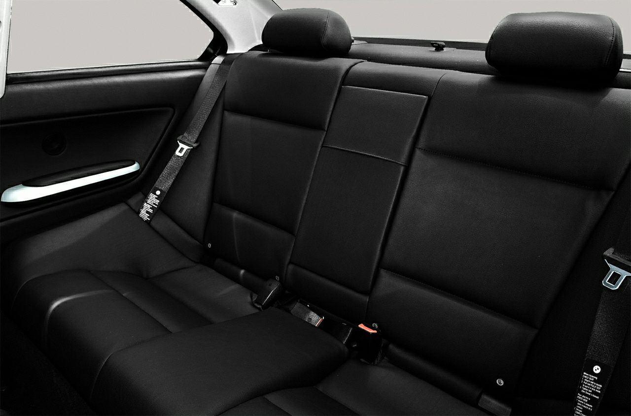 Rear leather seats with seatbelts and headrests