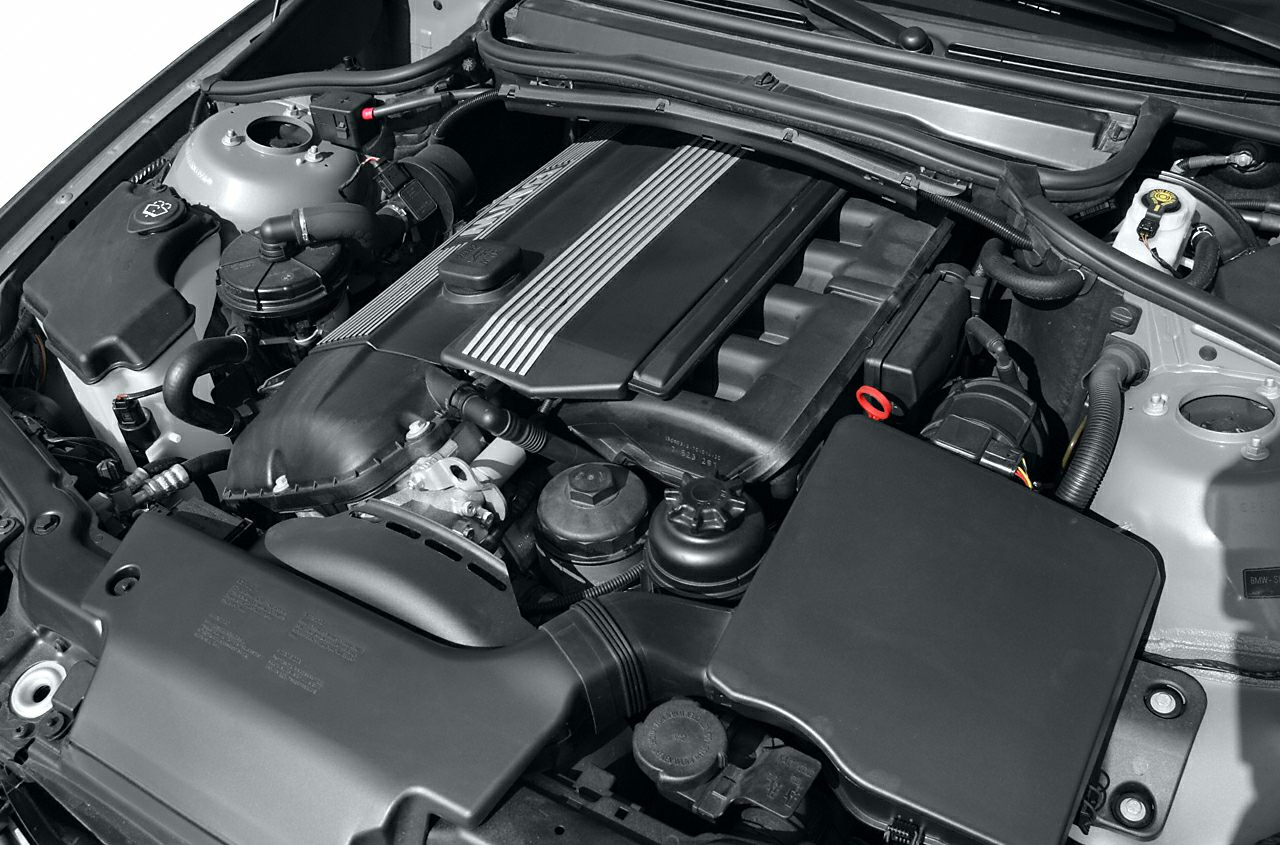 Engine bay with intake manifold and engine cover close-up