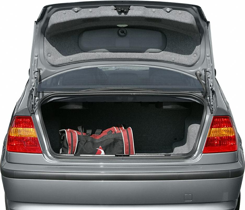 Open trunk and rear taillights of a mid-2000s sedan