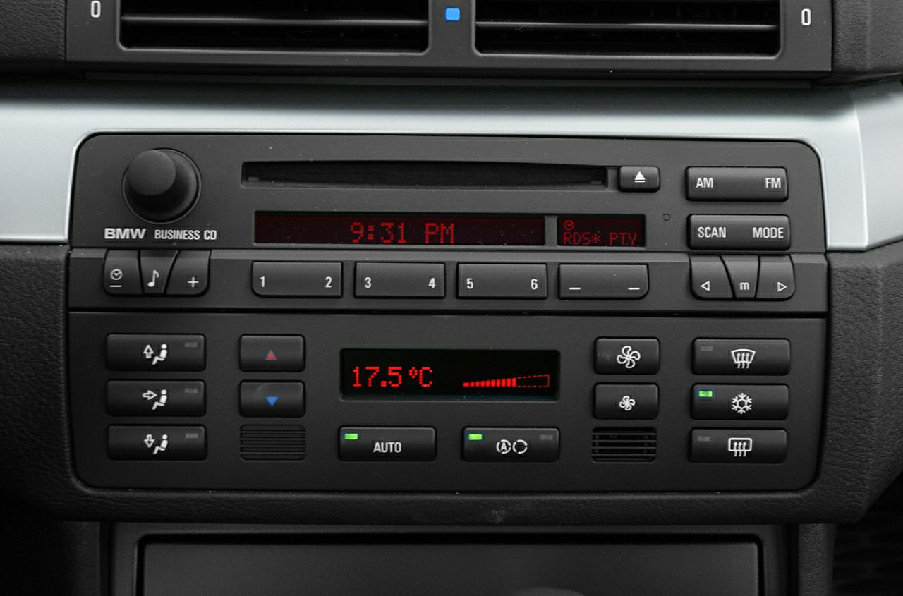 Radio and automatic climate control panel with temperature display and preset buttons
