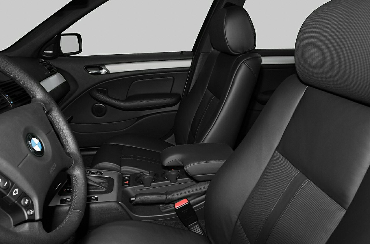 Black leather seats and dashboard interior with center console and steering wheel