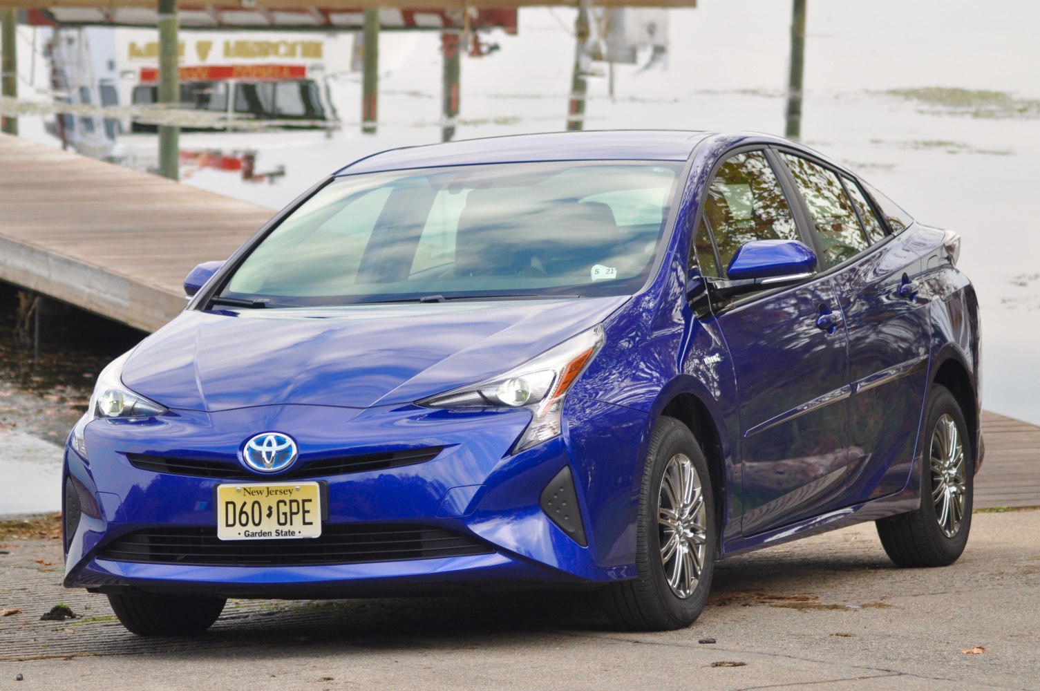 Front view of hybrid sedan with sharp LED headlights and aerodynamic body