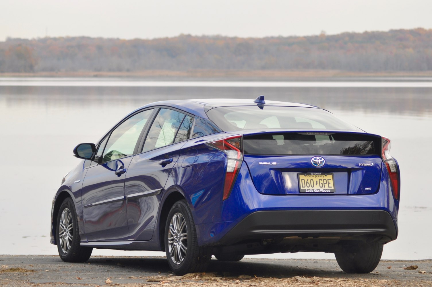 Blue hatchback rear and side view with futuristic tail lights.