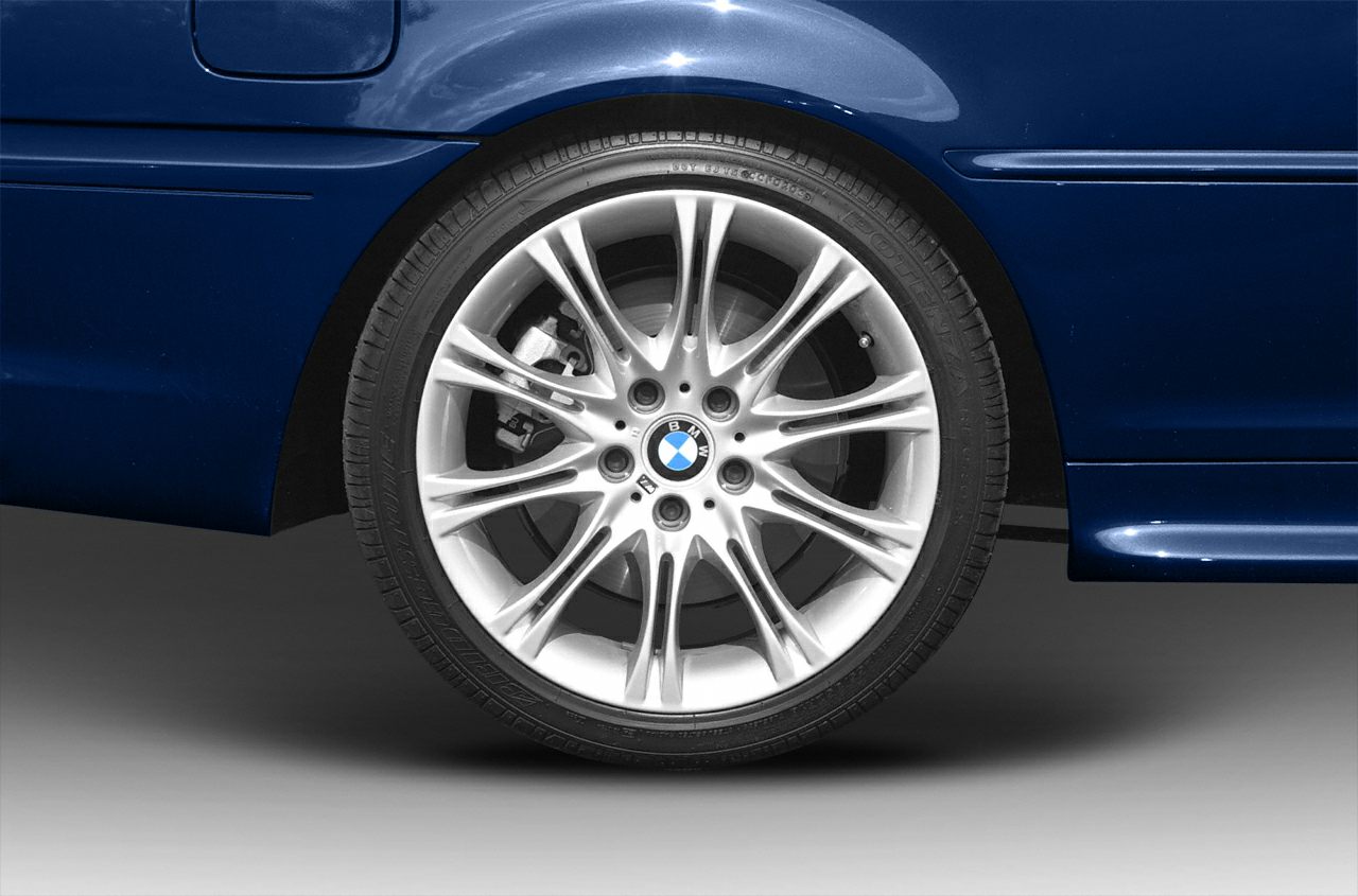 Close-up of BMW 3 Series alloy wheel and brake caliper.