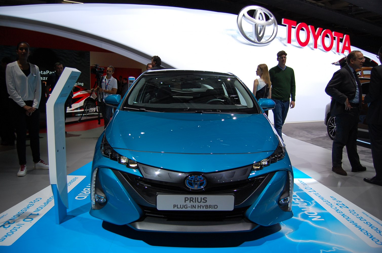 Blue plug-in hybrid front with sleek headlights and aerodynamic design