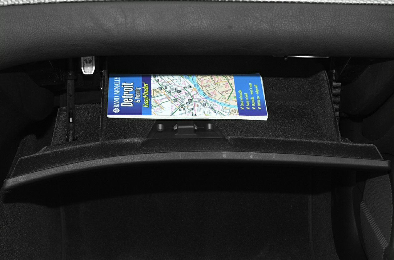 Open glove compartment with a map inside