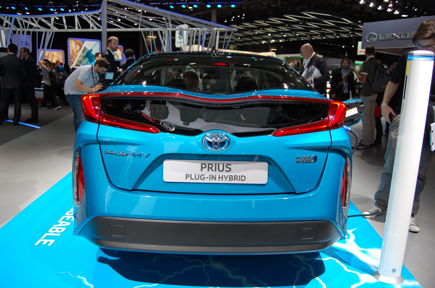 Rear view of a plug-in hybrid with distinct taillights and charging port.