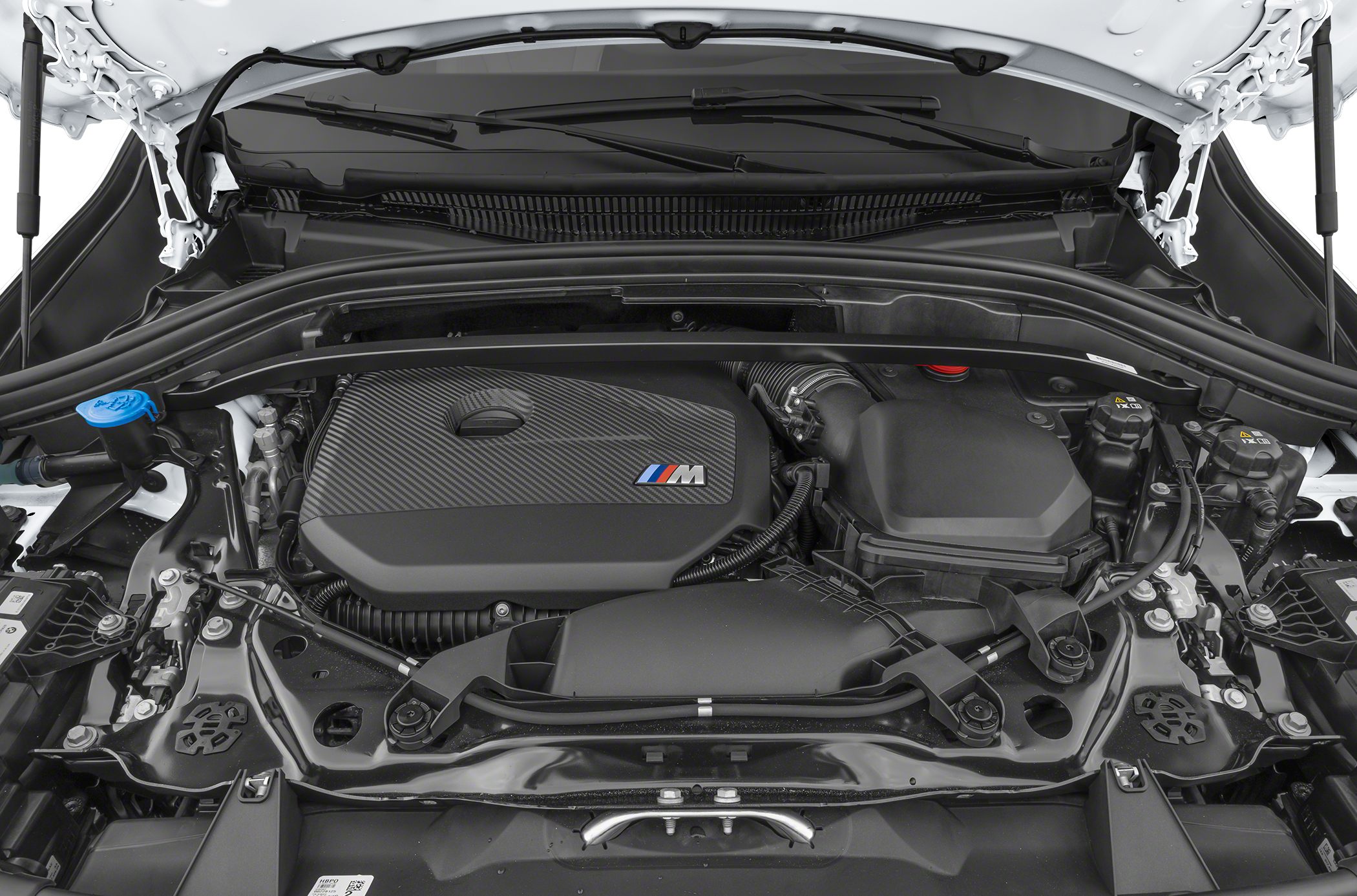 Carbon fiber engine cover with BMW M logo in engine bay