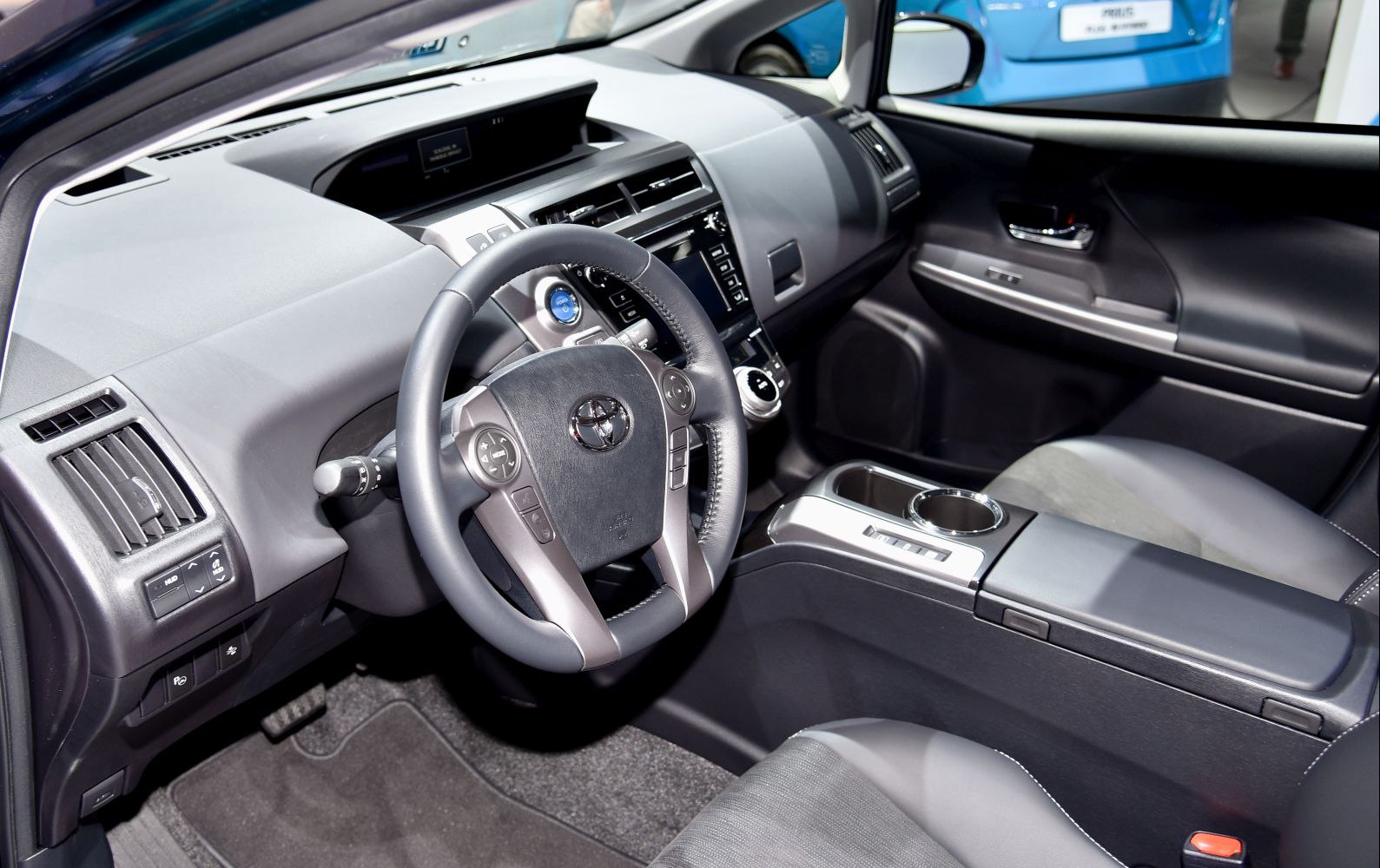 Modern hybrid car interior with dashboard and multifunction steering wheel