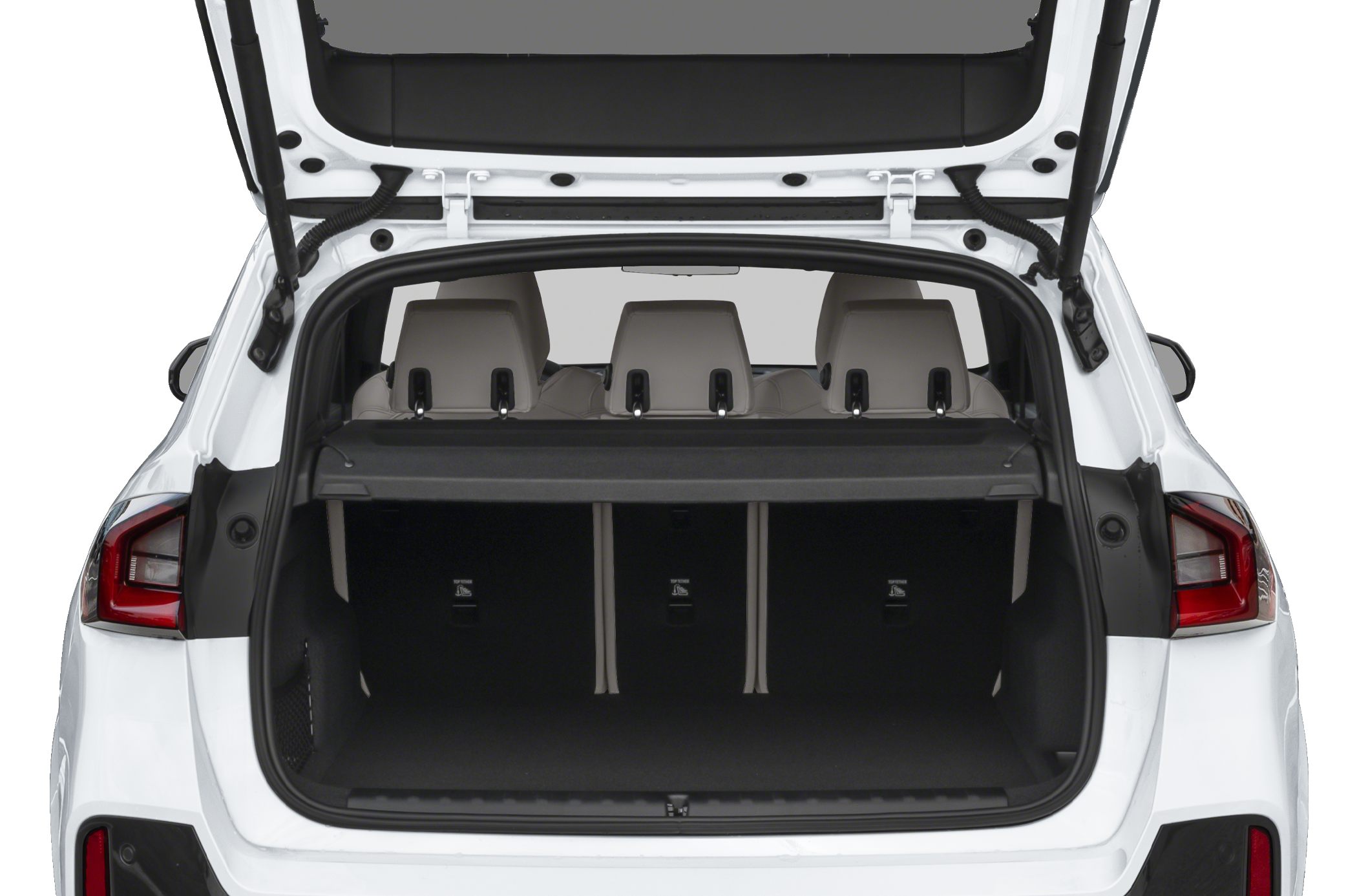 Open rear trunk with cargo area and three headrests