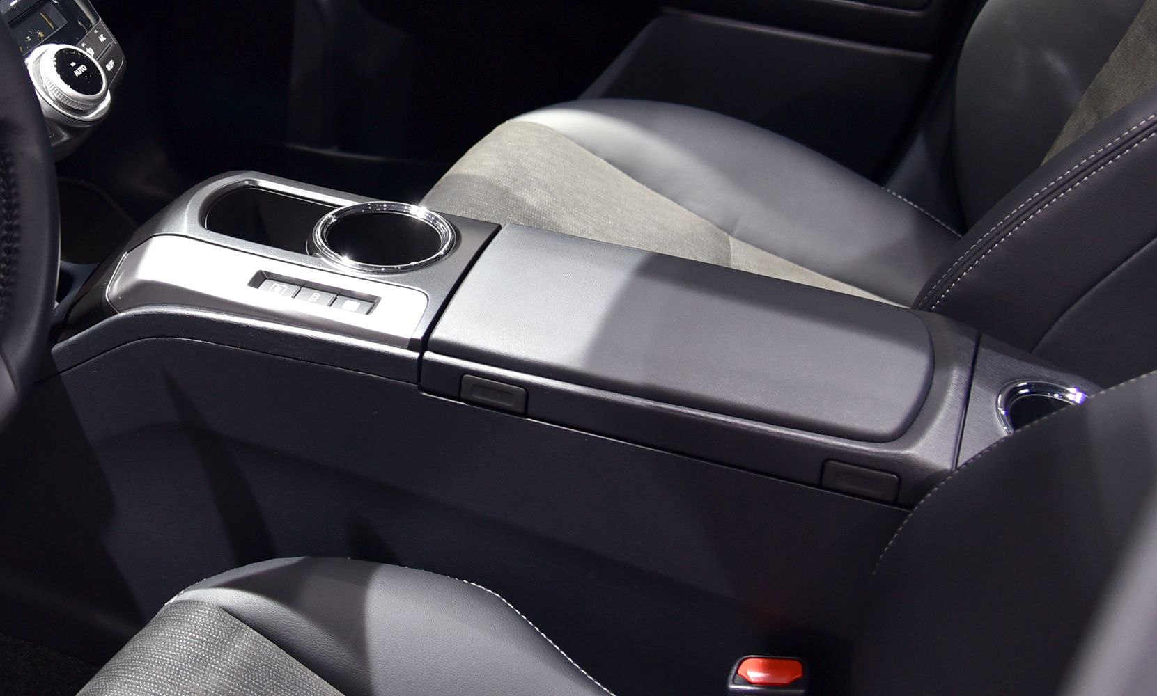 Center console with armrest and cup holders, modern interior design