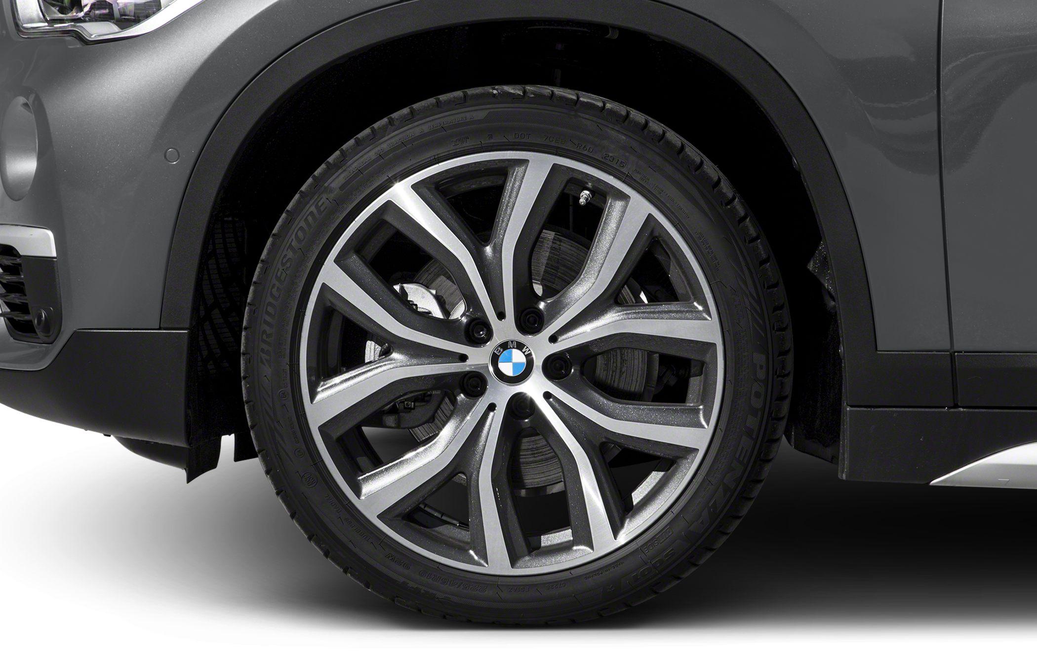 Close-up of alloy wheel with multi-spoke design and Bridgestone tire