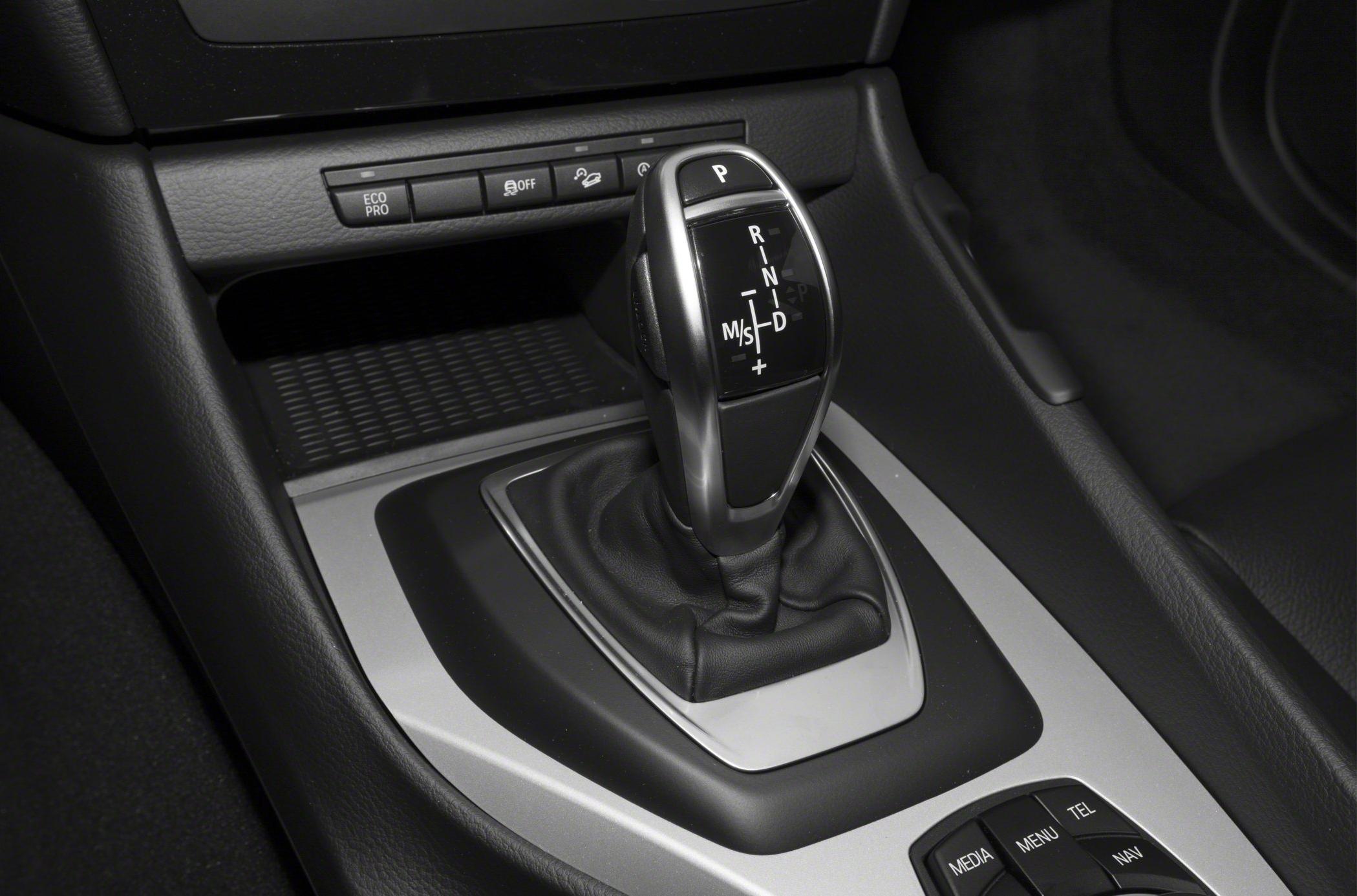 Automatic gear selector and interior control buttons in a modern car console