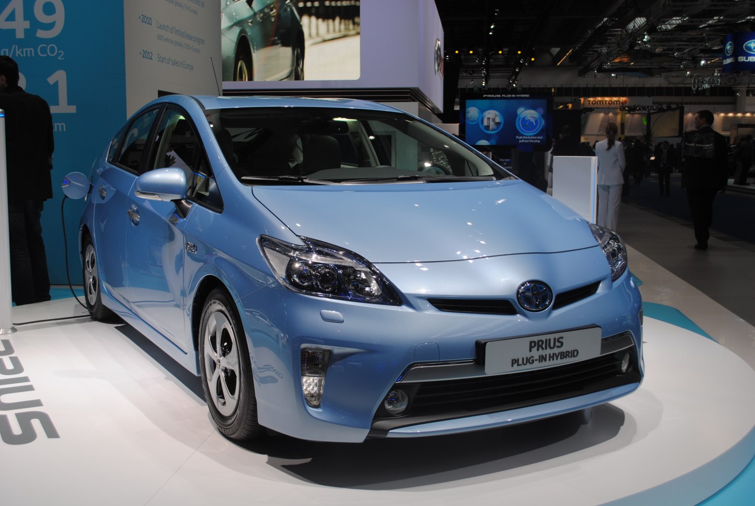 Blue plug-in hybrid sedan with aerodynamic design and modern headlights