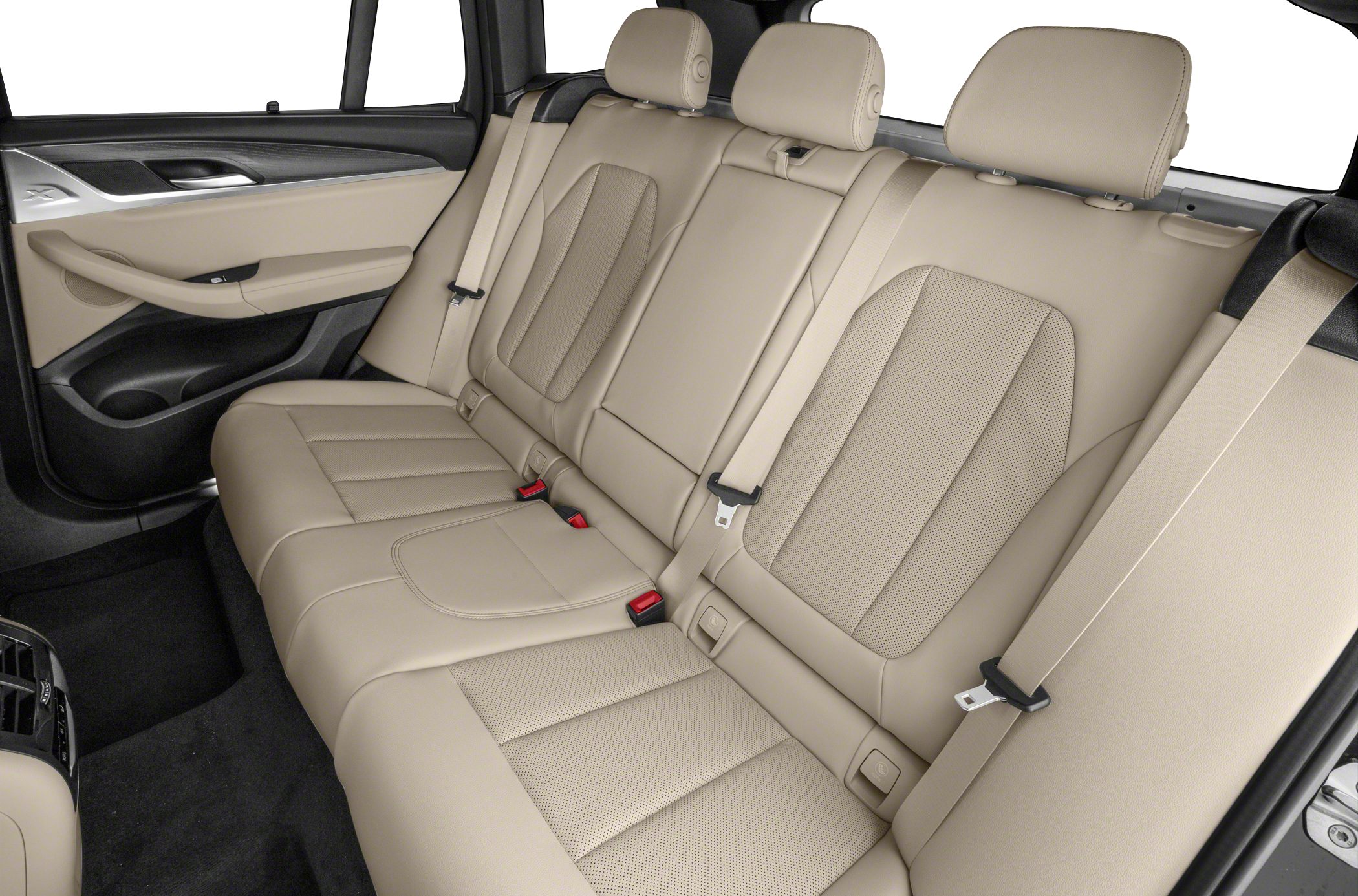 Rear beige leather seats with detailed stitching and seat belts