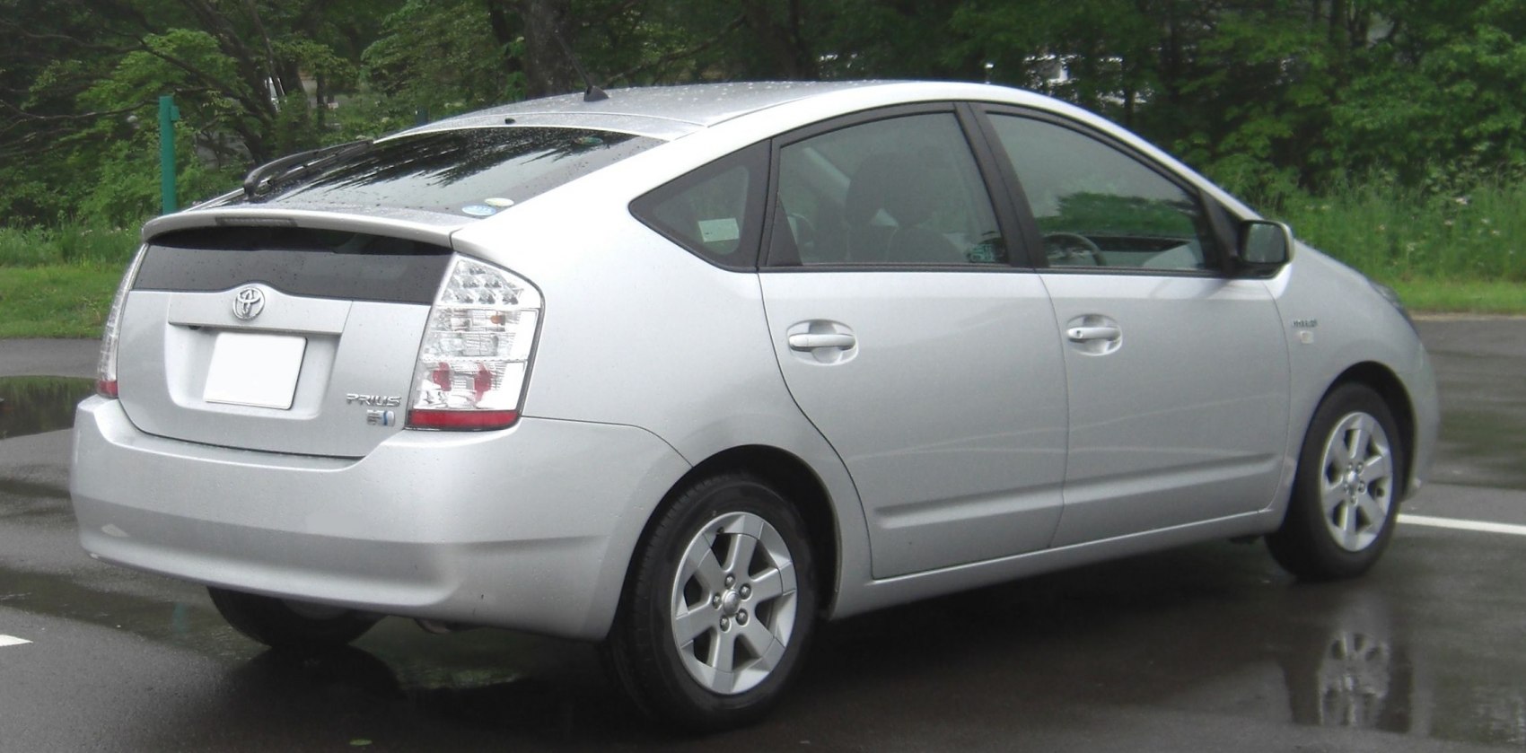 Aerodynamic hybrid hatchback rear side with distinct tail lights and five-door layout