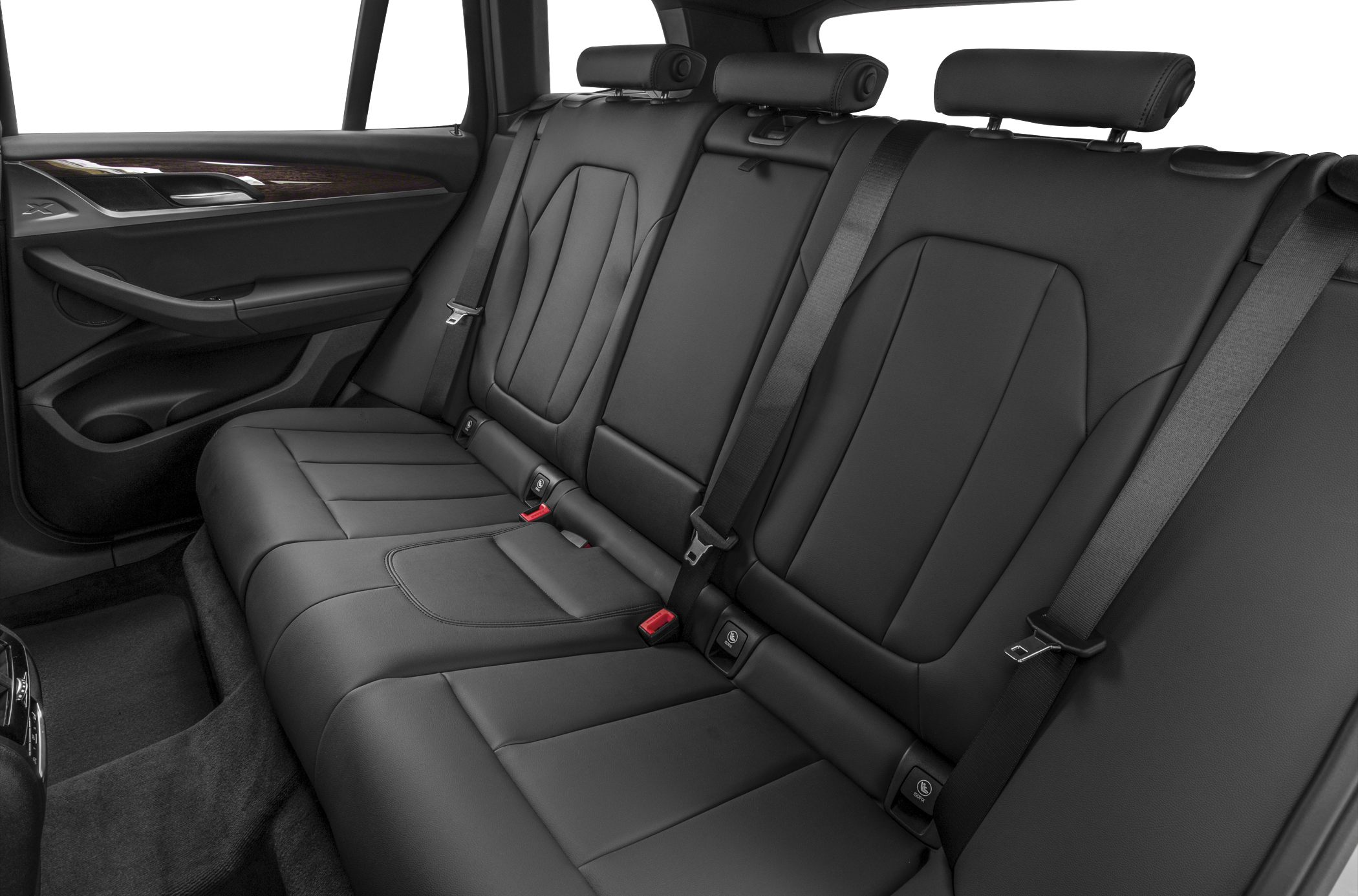 Black leather rear seats with headrests and seatbelts.