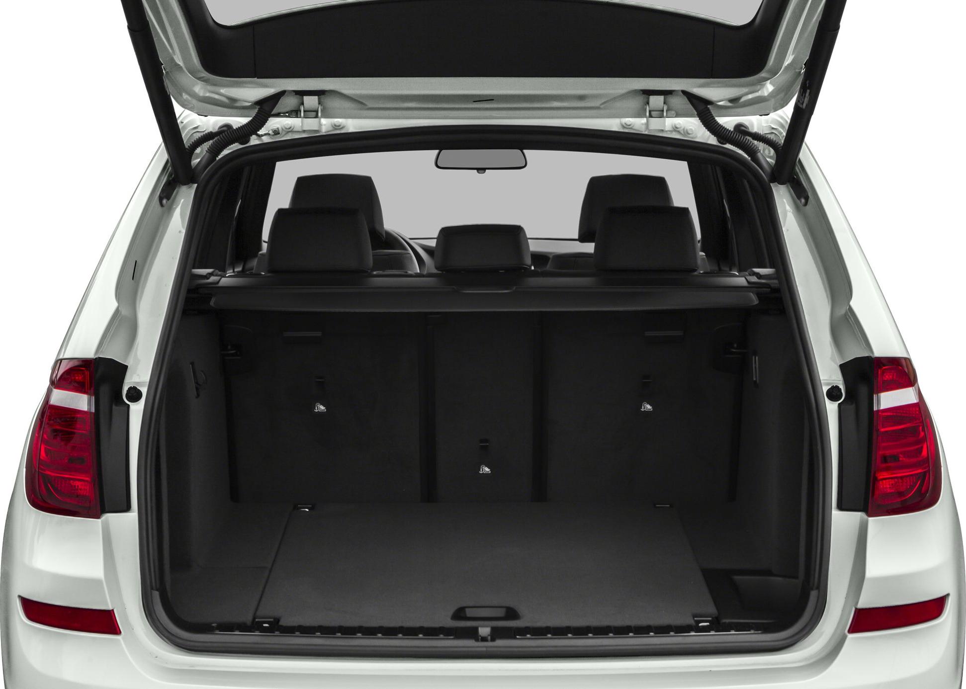 Open rear cargo area with tailgate and passenger seats visible
