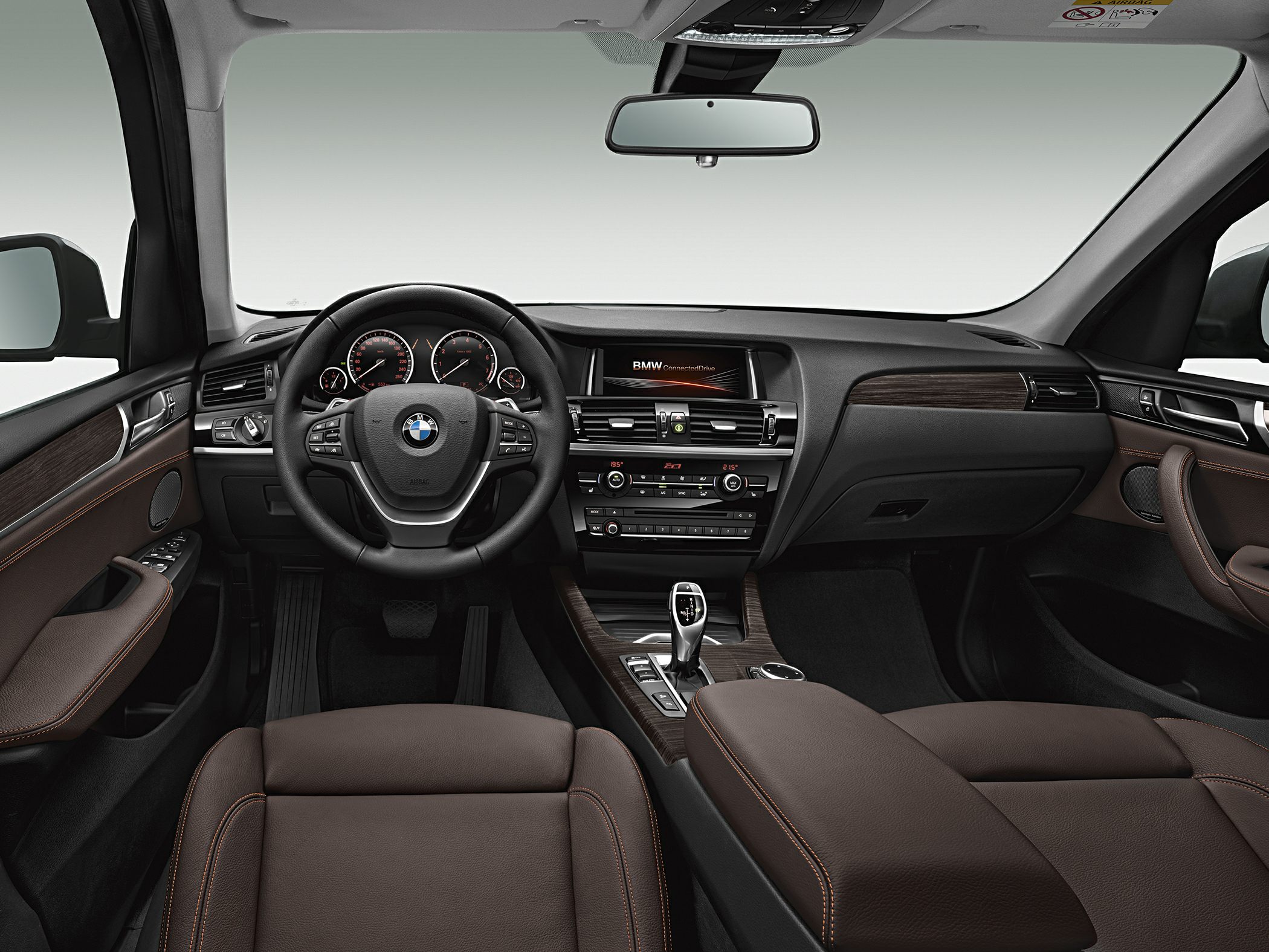Steering wheel, dashboard, infotainment, brown leather seats interior