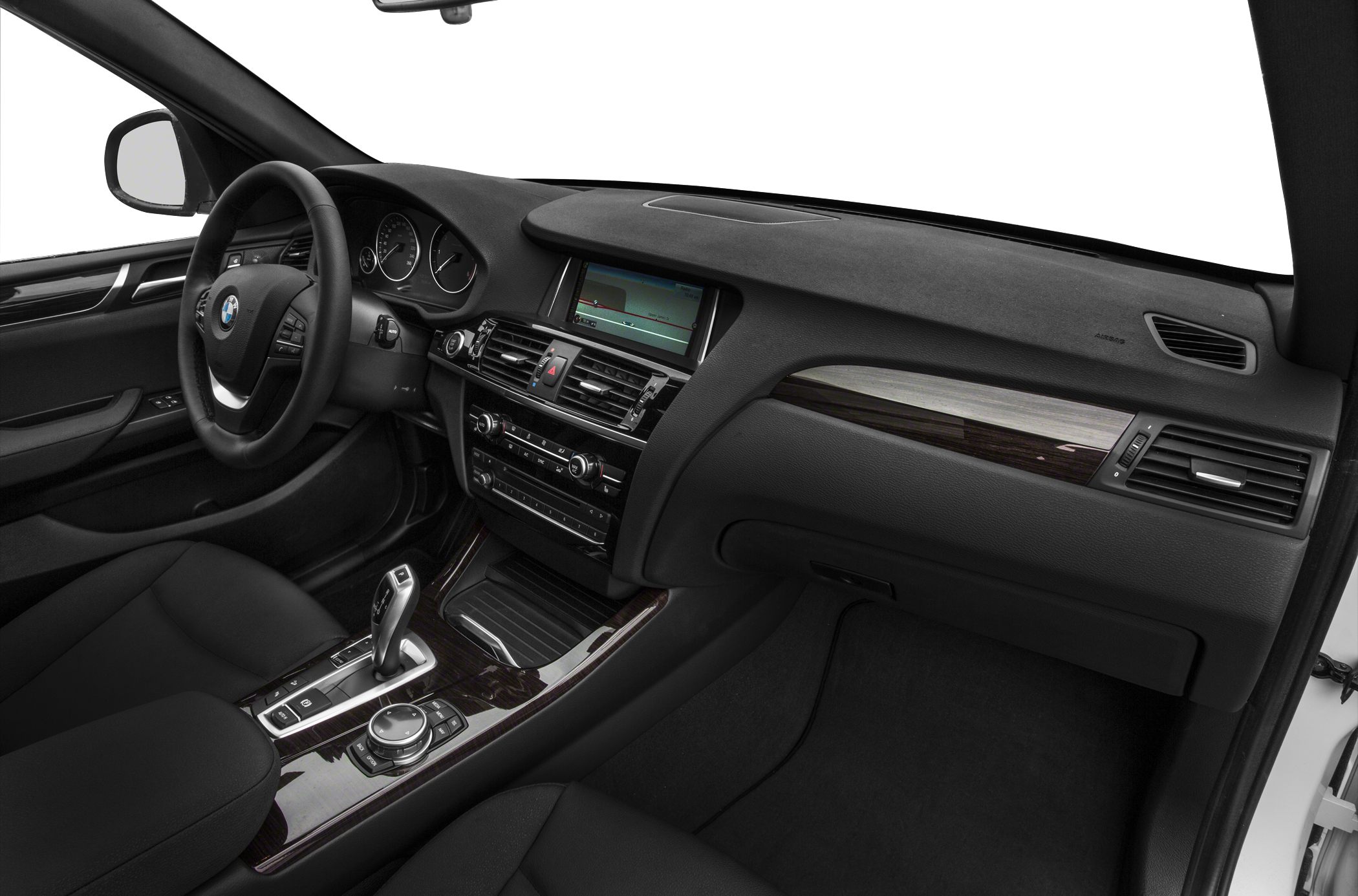 Dashboard with multimedia screen and steering wheel, center console with gear selector and controls.