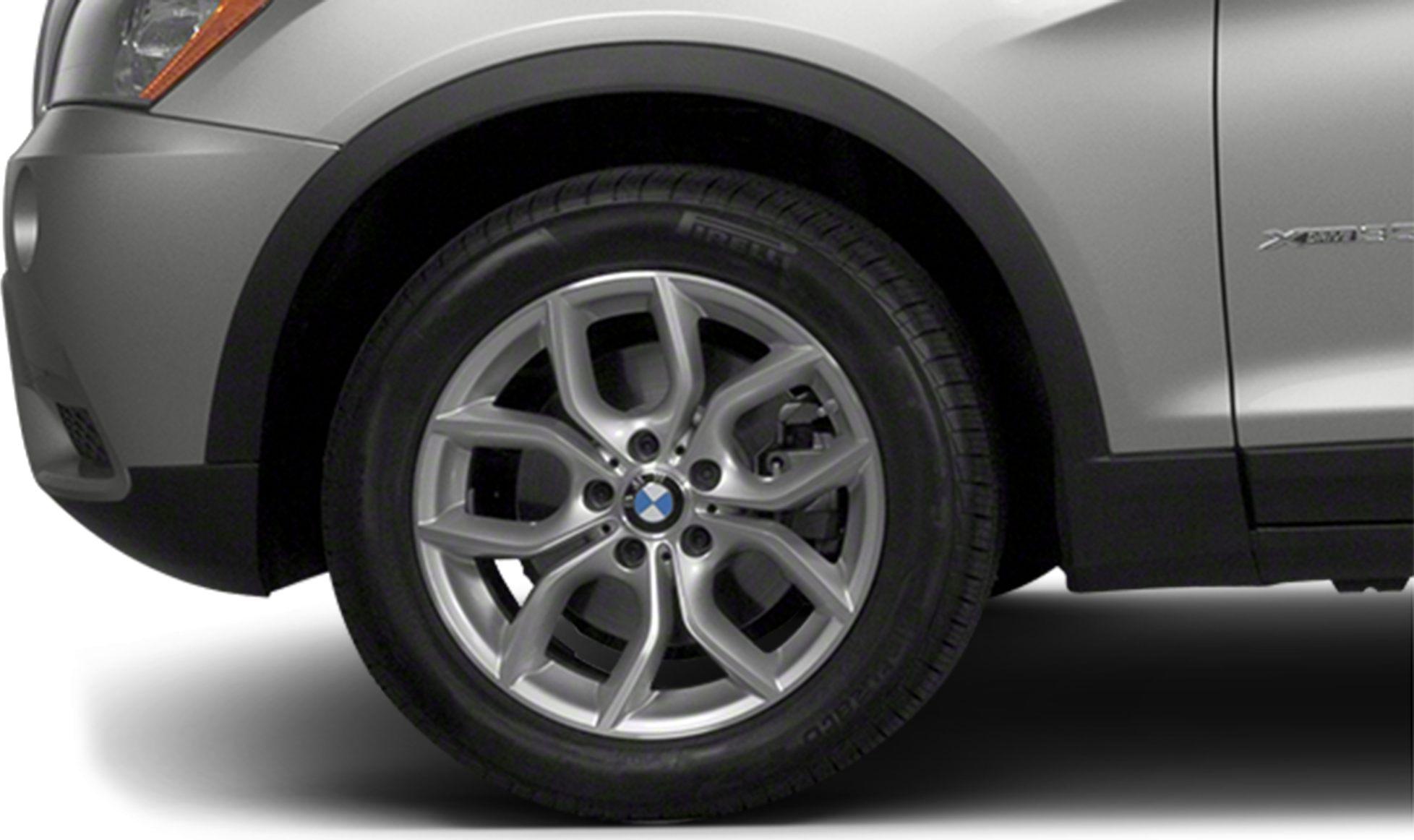 Close-up view of alloy wheel with intricate spoke design and tire tread