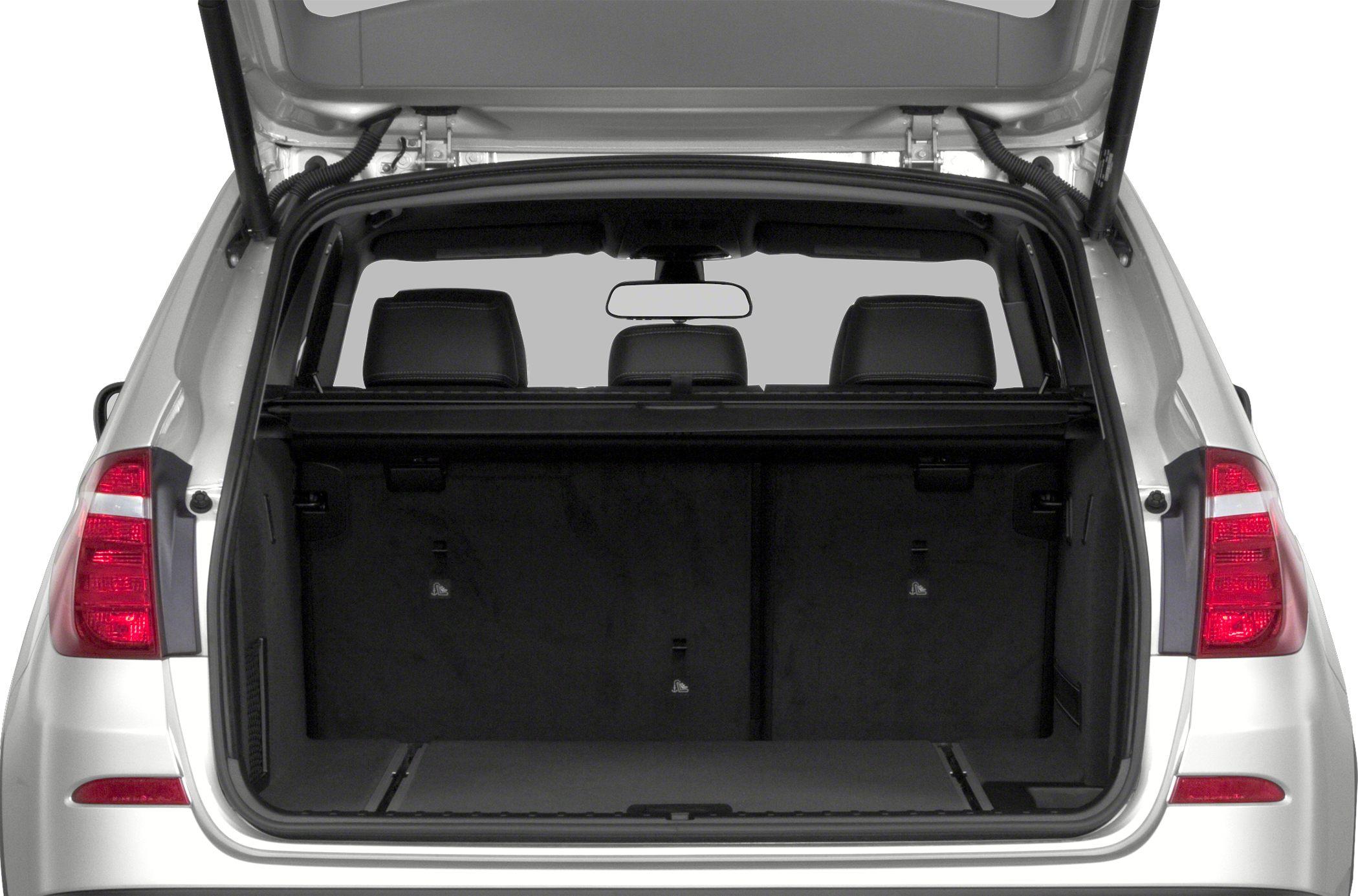Open spacious rear cargo area with visible folded rear seats and black interior.