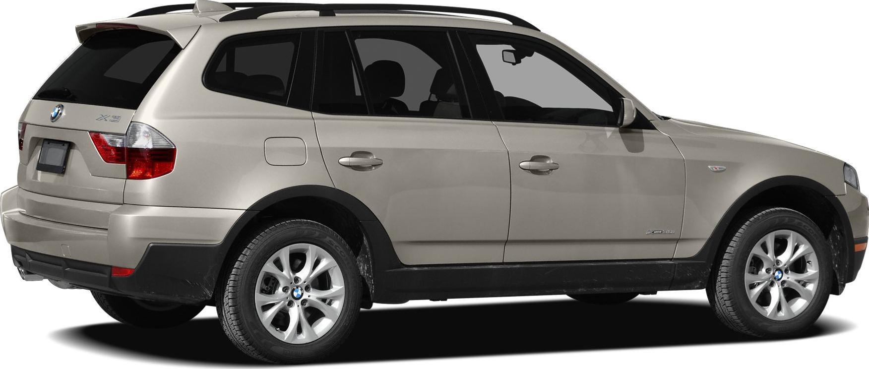 Rear side view of a beige SUV with alloy wheels and roof rails