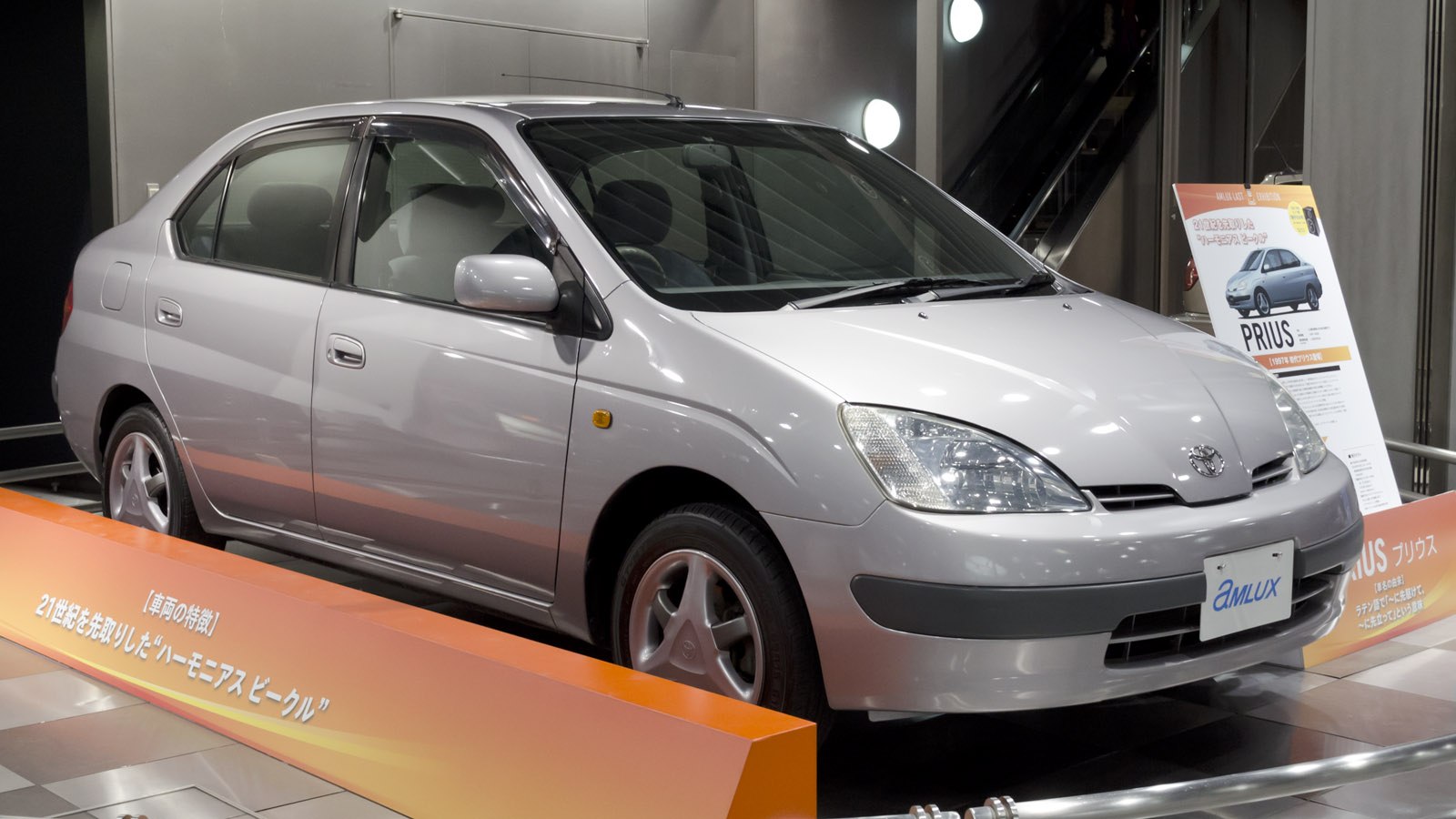 Aerodynamic hybrid sedan with LED headlights and smooth curves