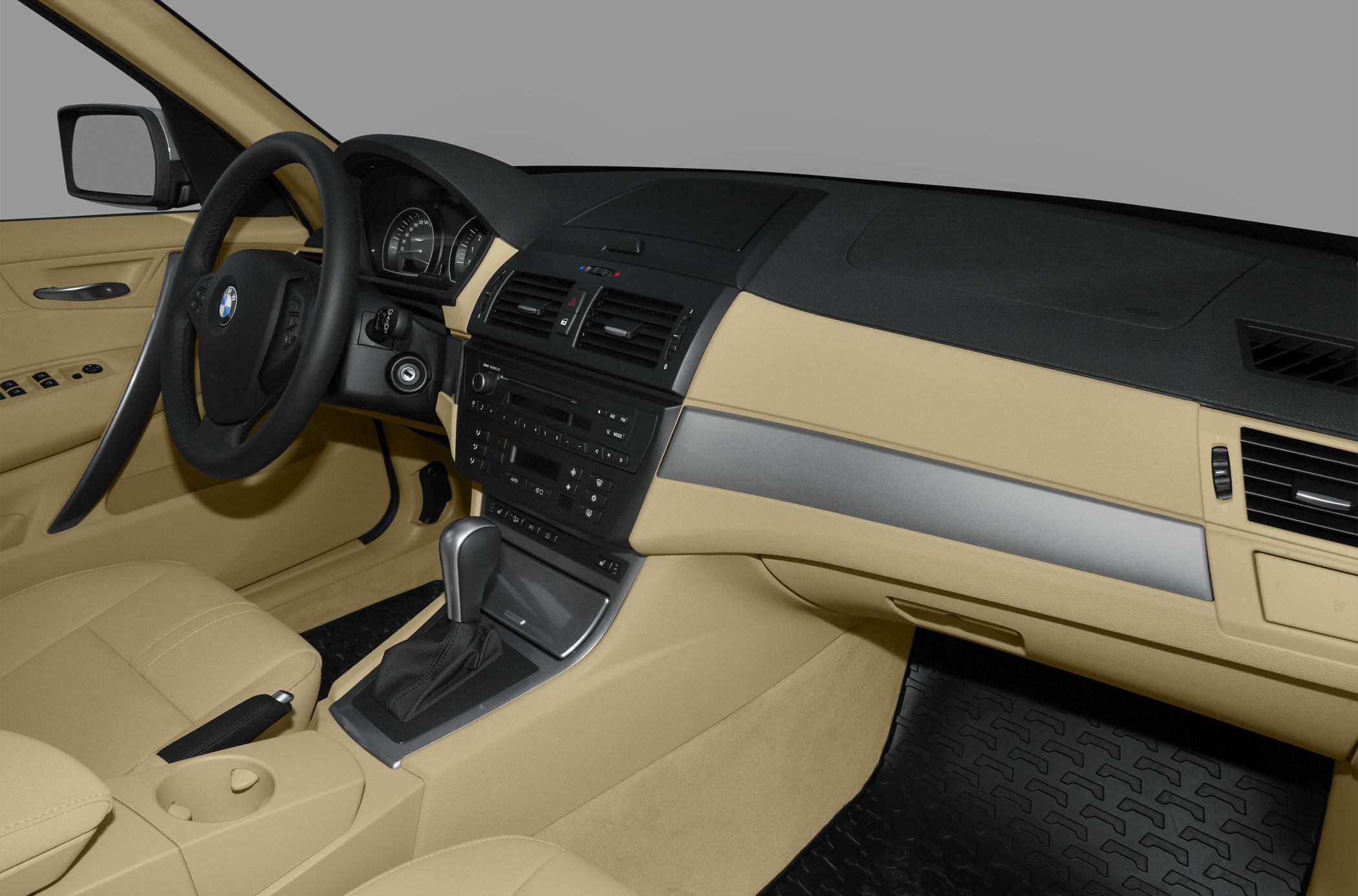 Beige car interior with dashboard and steering wheel