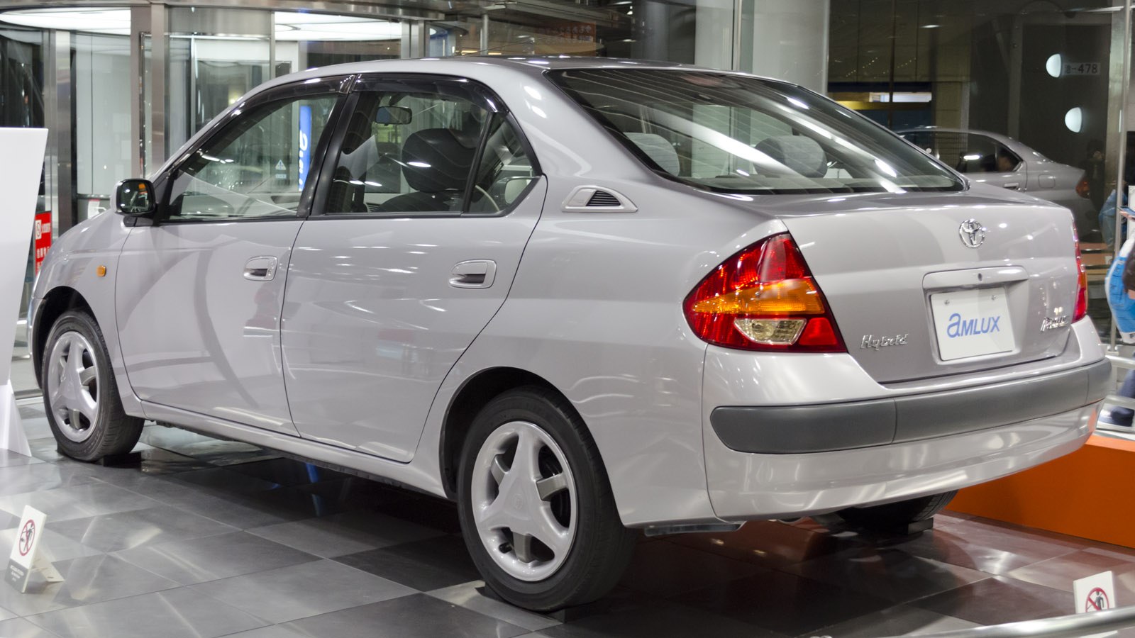 Rear side view of hybrid hatchback with distinctive taillights and aerodynamic shape