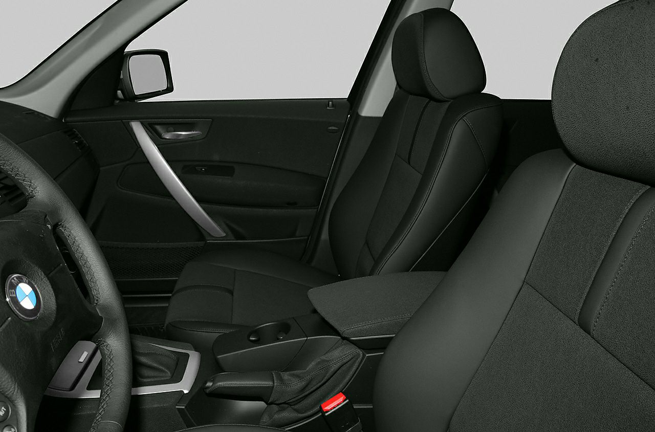 Front seats, steering wheel, and center console interior close-up